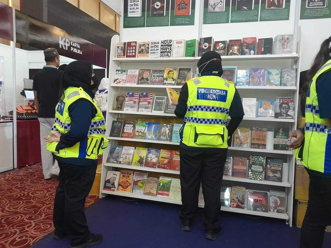 Enforcement officers from the home ministry seen at the 2023 Kuala Lumpur International Book Fair. Photo: Facebook Benz Ali