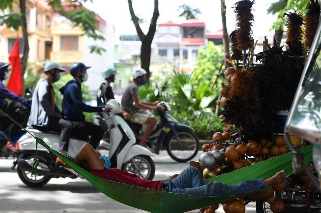 To deal with the problem, Hanoi turns on its public lighting half an hour later than usual, and switches it off half an hour sooner, while halving illumination on some major roads and in public parks. Photo: AFP