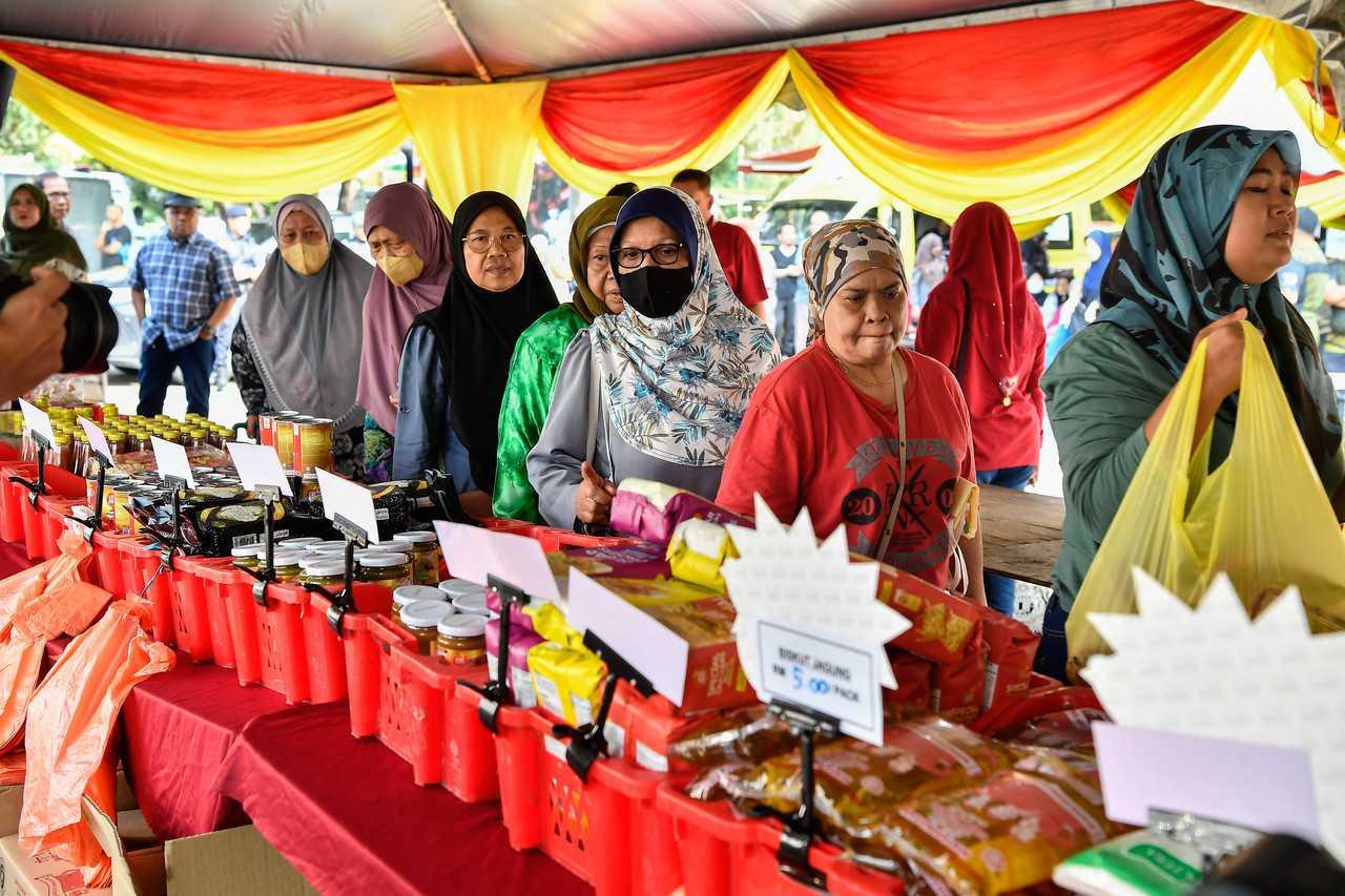 Visitors purchase basic necessities at the Ehsan Rahmah Mega Sale programme in Kuala Lumpur today. Photo: Bernama