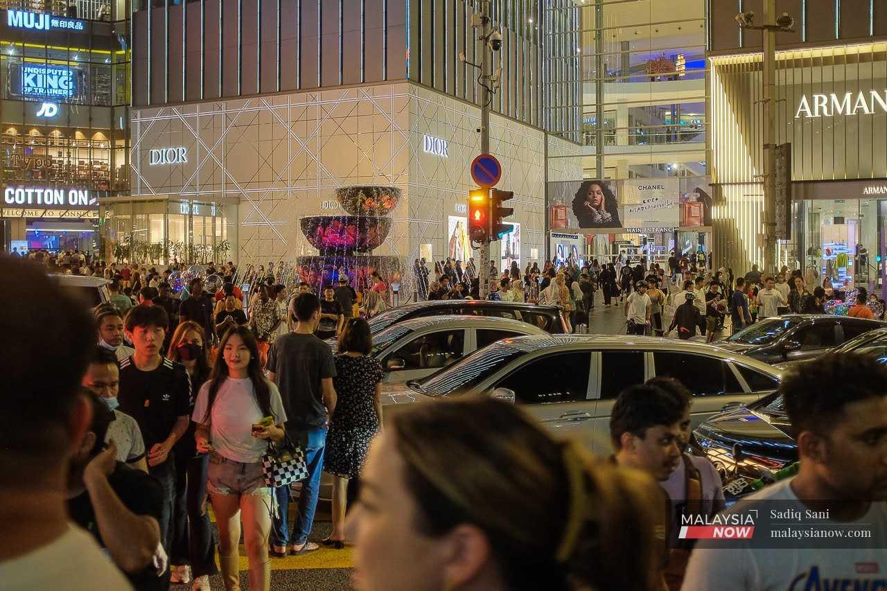 Crowds mill at the Pavilion mall in the Bukit Bintang shopping district in Kuala Lumpur. 