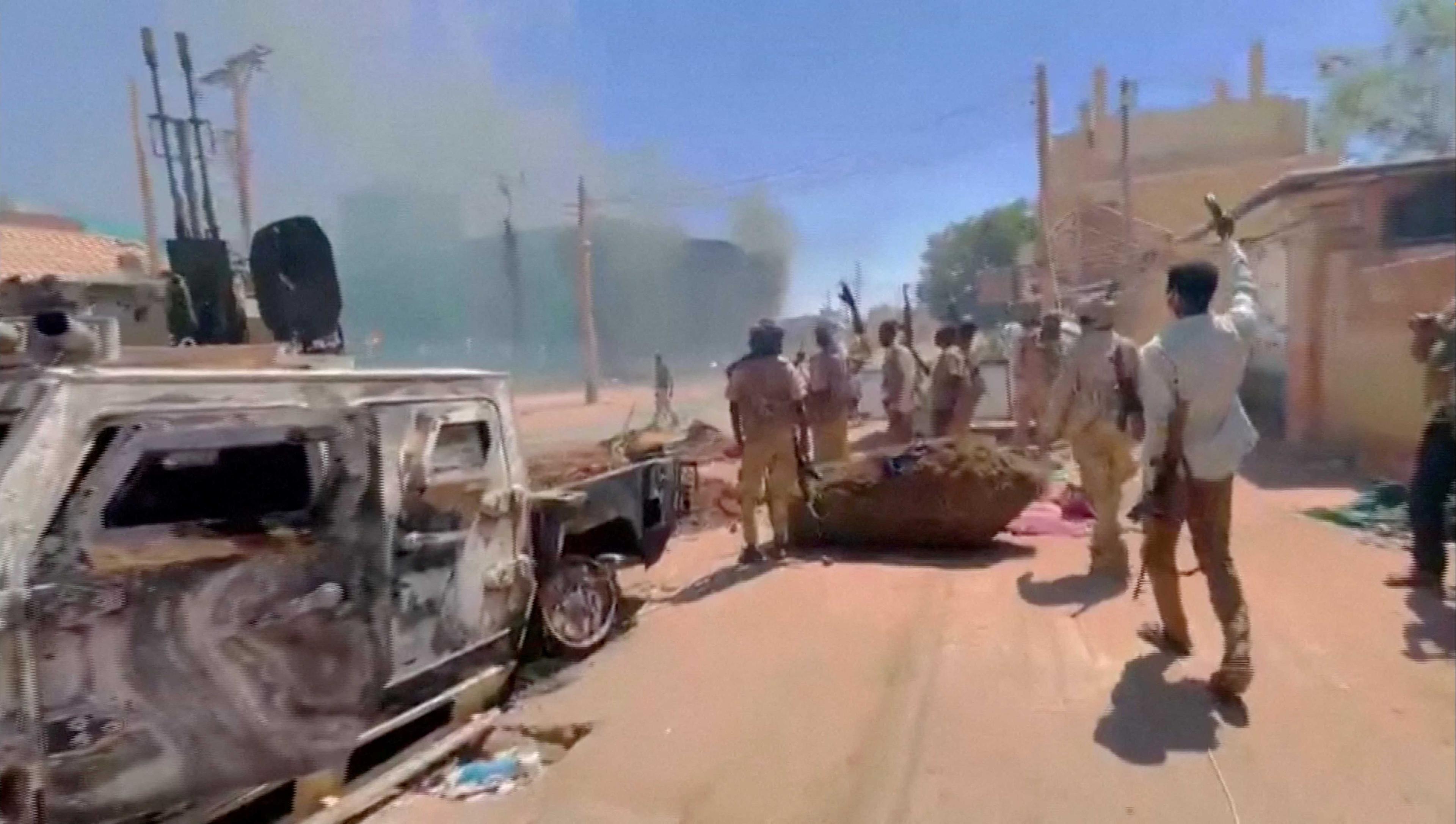 RSF fighters stand near the damaged Air Defence Forces command centre in Khartoum, Sudan May 17, in this screen grab obtained from a social media video. Photo: Reuters
