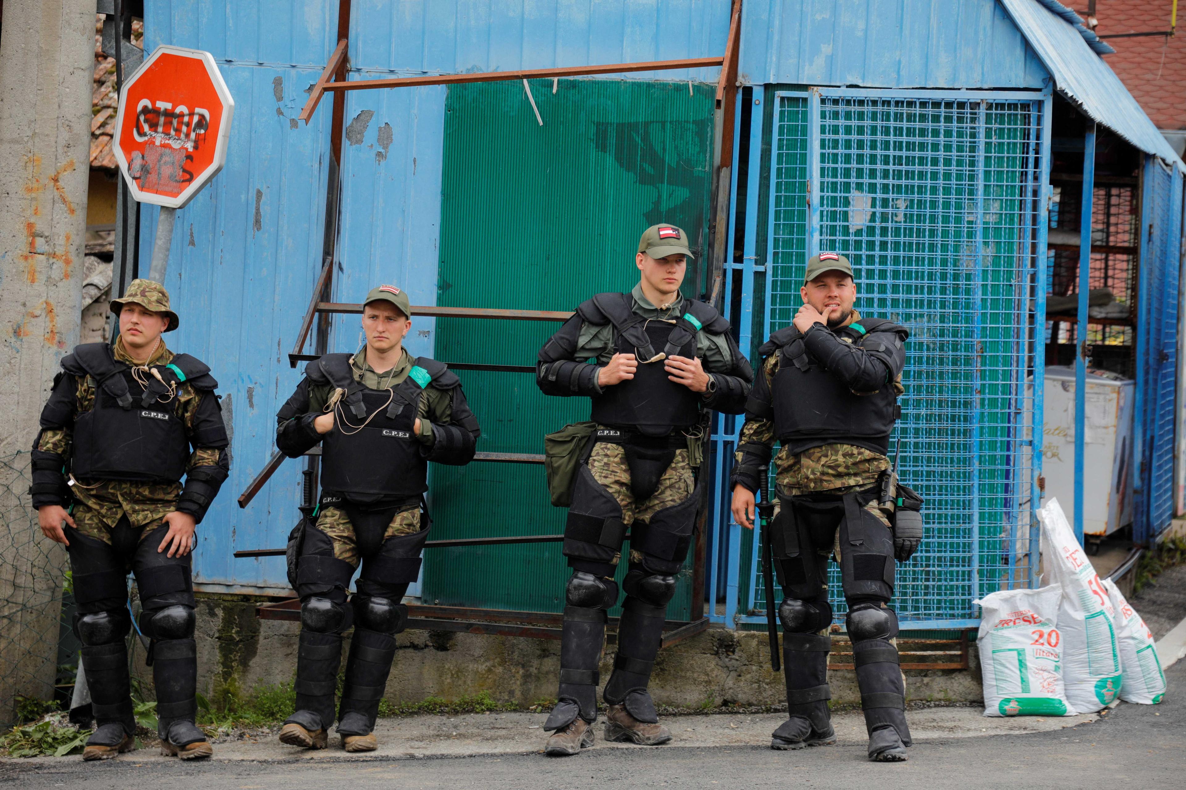 Latvian members of the Nato-led Kosovo Force stand guard near a municipal building in Zubin Potok, Kosovo, May 31. Photo: Reuters