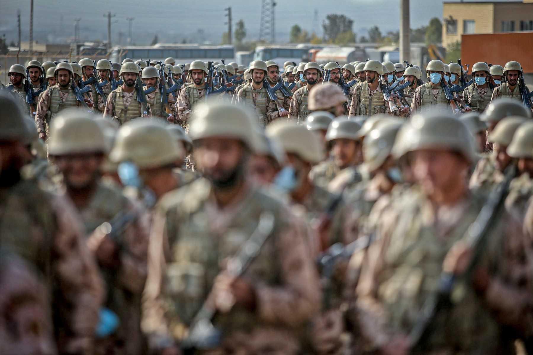 This handout photo provided by Iran's Islamic Revolutionary Guard Corps Ground Forces on Oct 18, 2022 shows soldiers taking part in a military drill in the northwestern region of Aras along the borders of Armenia and Azerbaijan. Photo: AFP  