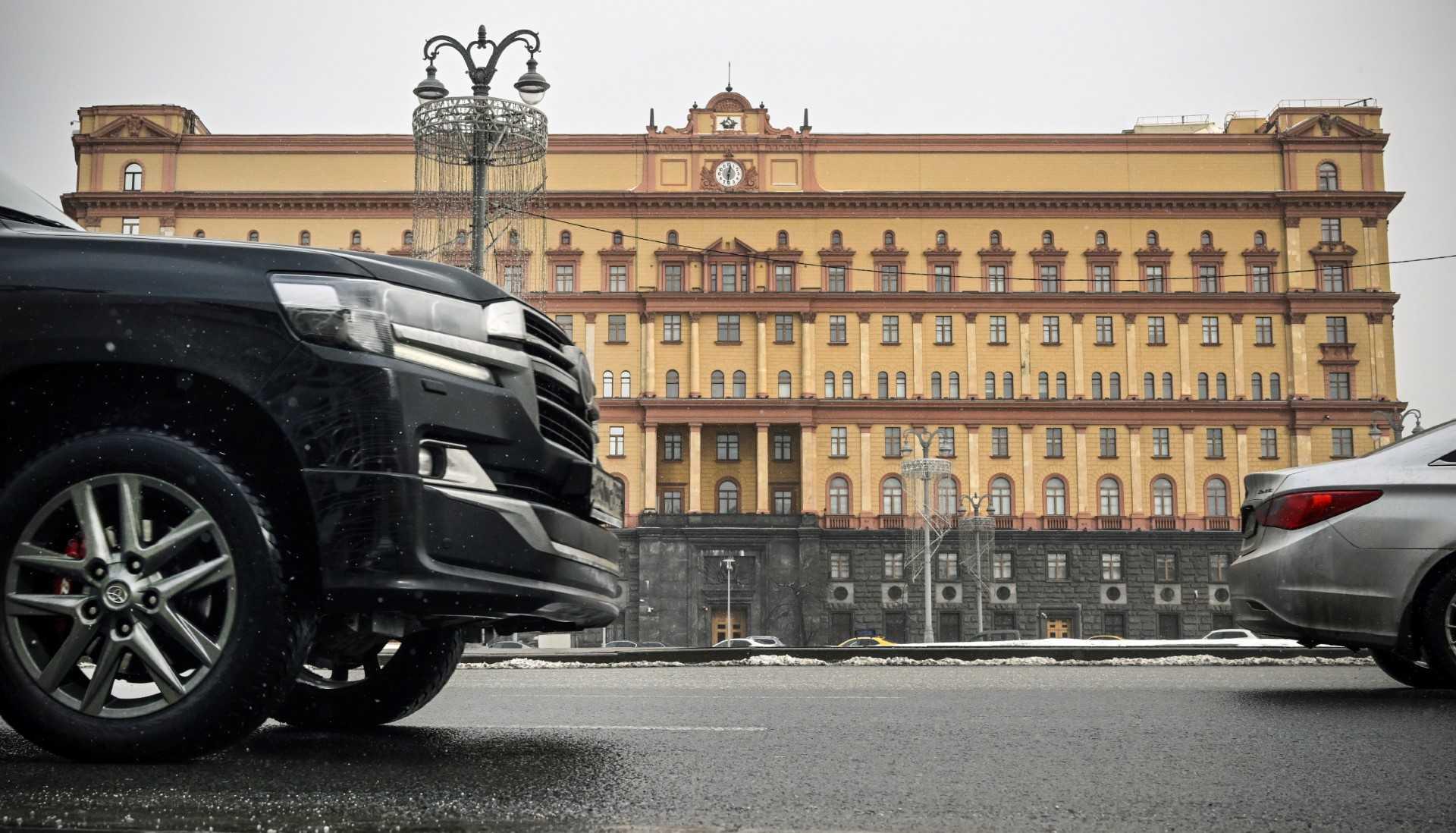 Cars go past the headquarters of the Federal Security Service (FSB), the successor agency to the KGB, and Lubyanka Square in front of it in central Moscow on March 3. Photo: AFP