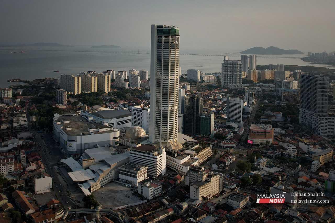 An aerial view of the Komtar building and the iconic Penang Bridge.