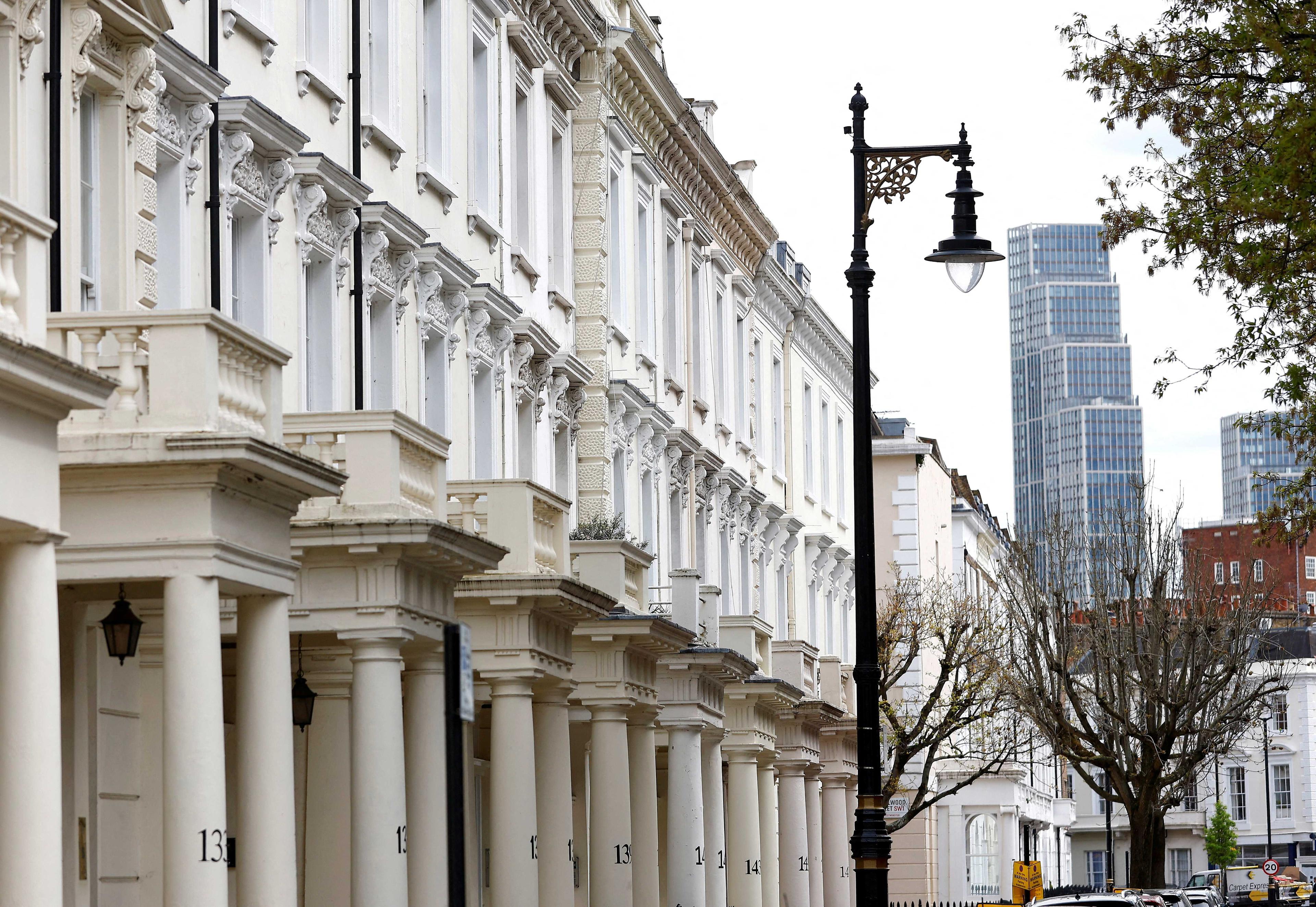 Apartment blocks are seen behind traditional housing in London, Britain, April 16. Photo: Reuters