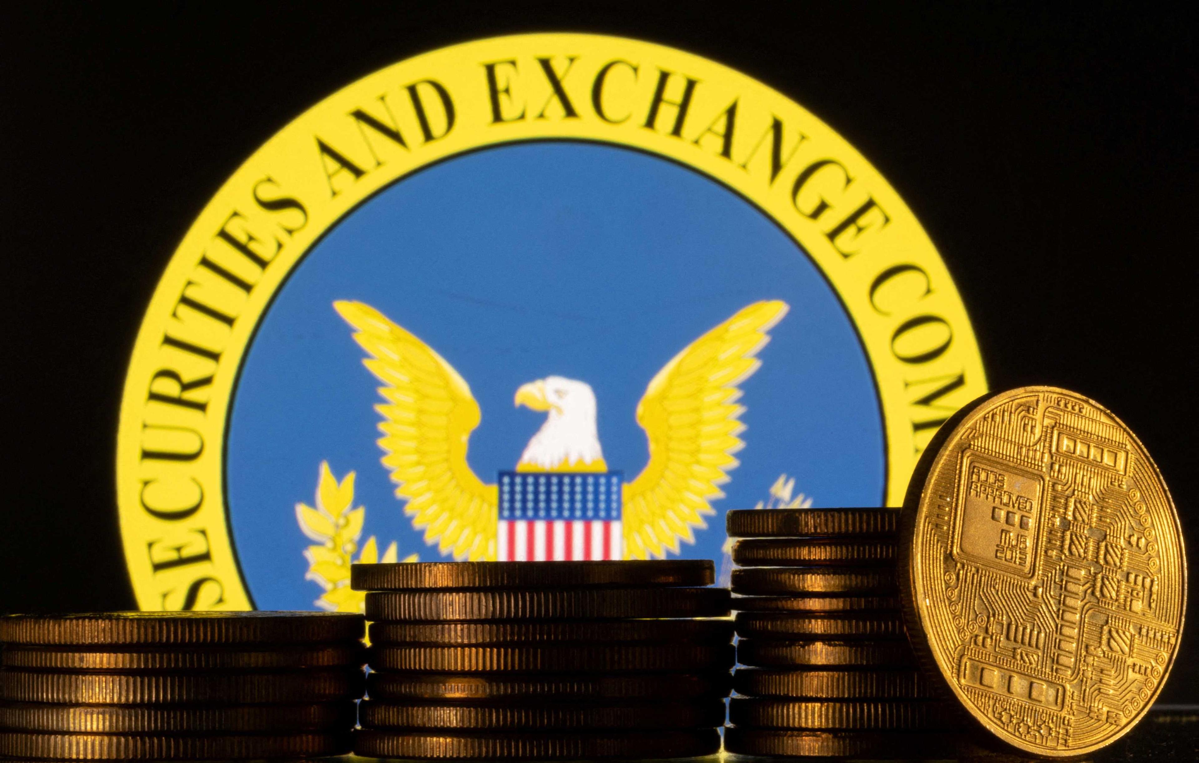 US Securities and Exchange Commission logo and representations of cryptocurrency are seen in this illustration taken June 6. Photo: Reuters