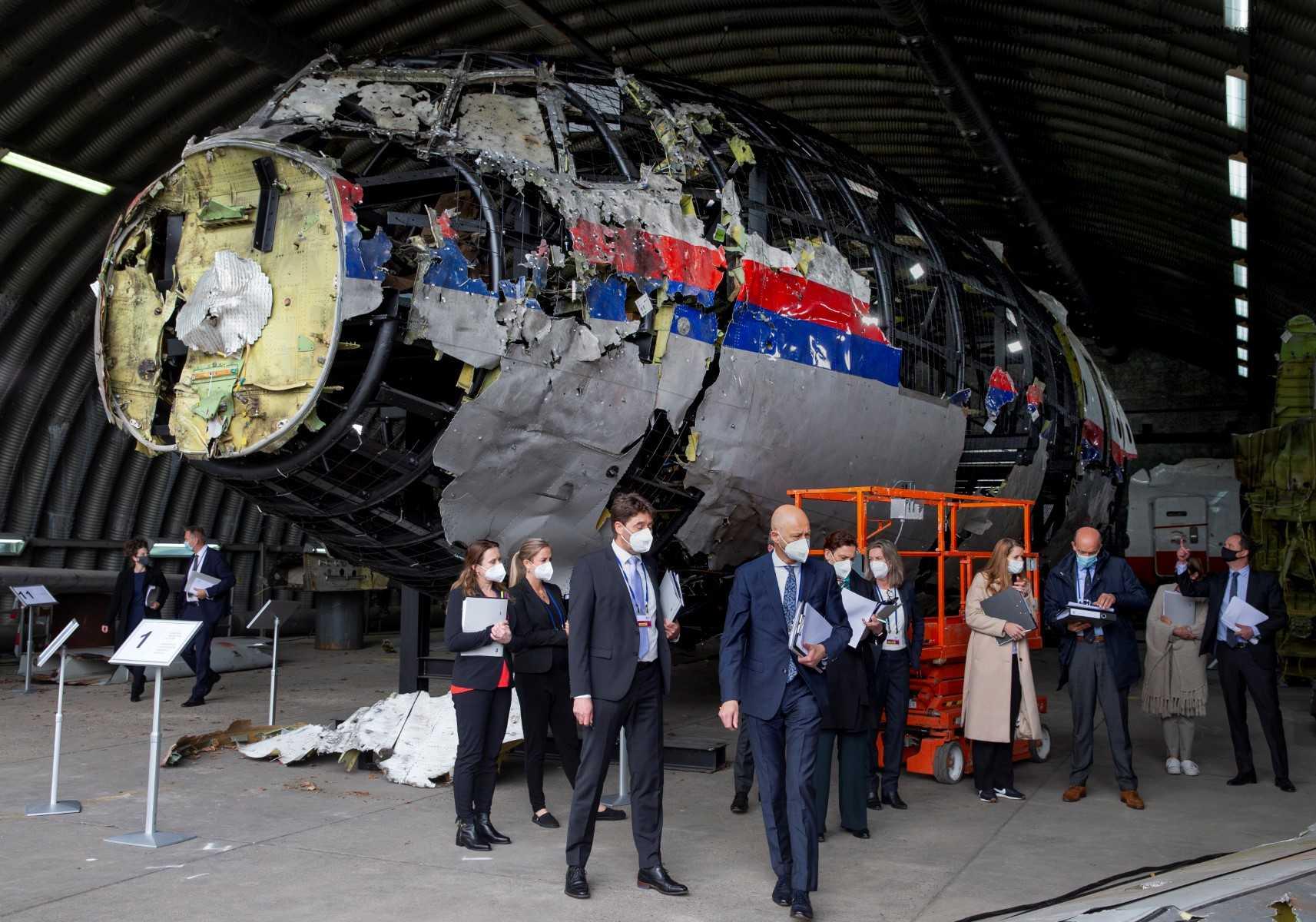 Trial judges and lawyers view the reconstructed wreckage of Malaysia Airlines Flight MH17, at the Gilze-Rijen military Airbase, southern Netherlands, on May 26, 2021. Photo: AFP