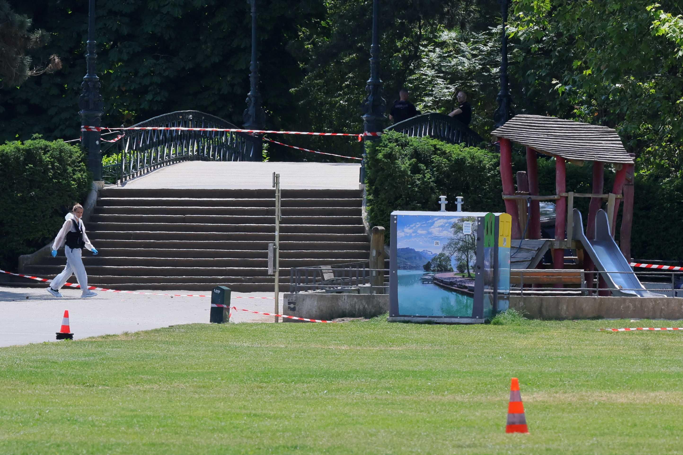 French scientific police work on the area after several children and adults have been injured in a knife attack at the Le Paquier park near the lake in Annecy, in the French Alps, France, June 8. Photo: Reuters