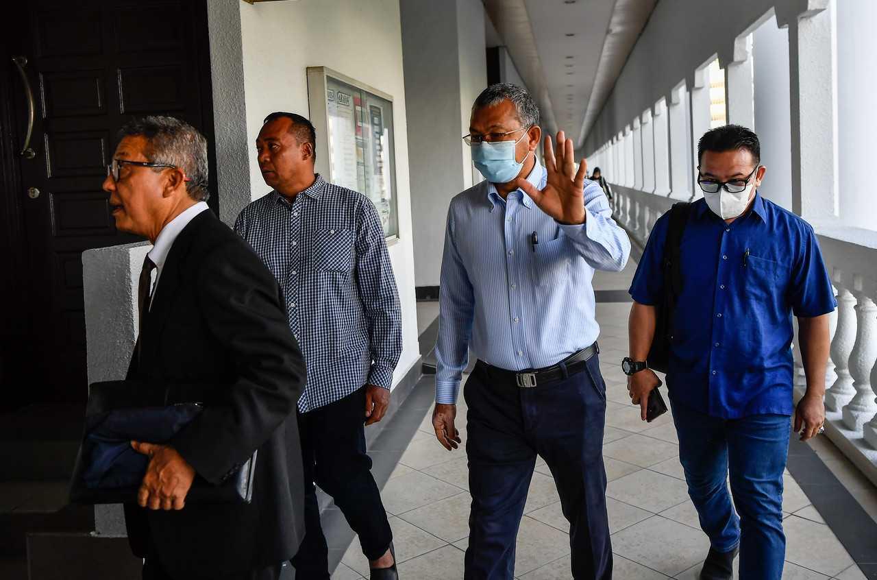Former Perlis menteri besar Azlan Man (second from the right) attends the hearing of his case at the Kuala Lumpur Sessions Court today. Photo: Bernama