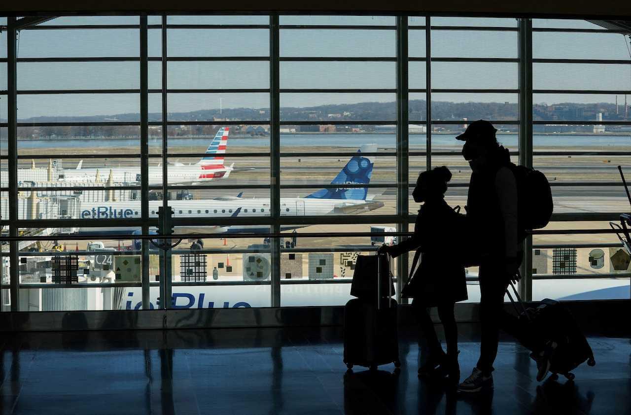 Passengers walk in the terminal at Ronald Reagan Washington National Airport. Photo: Reuters