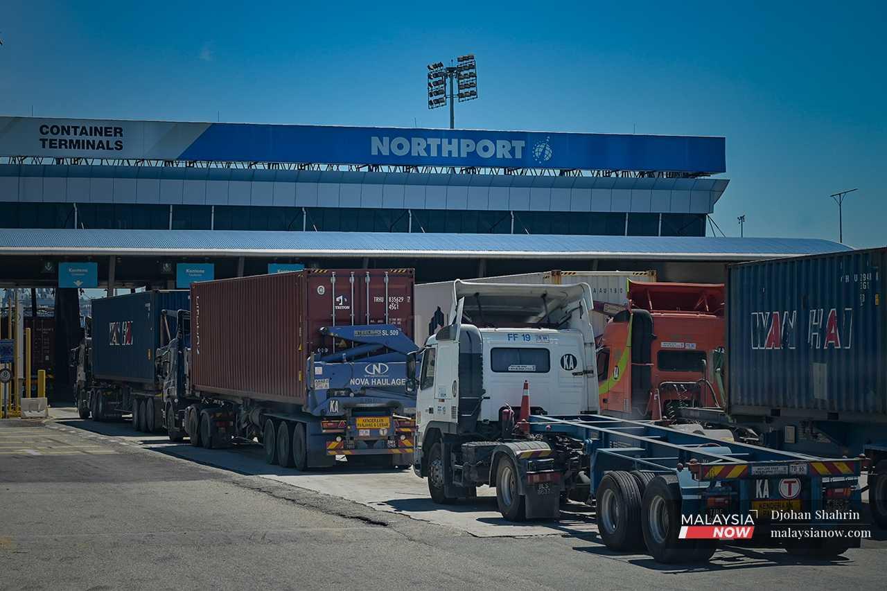 They wait for their turn at the Northport entrance, where they are checked for pick-ups and deliveries at the port. Security is tight, and each trailer is vetted for its documents and declaration of goods. 
