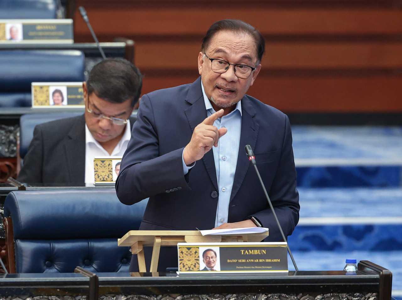 Prime Minister Anwar Ibrahim speaks during the Prime Minister's Question Time at the Dewan Rakyat today. Photo: Bernama