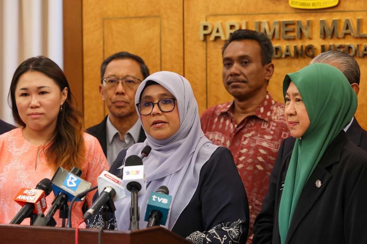 Public Accounts Committee chairman, Mas Ermieyati Samsudin (third from the left), speaks at a press conference at the Parliament building today. Photo: Bernama