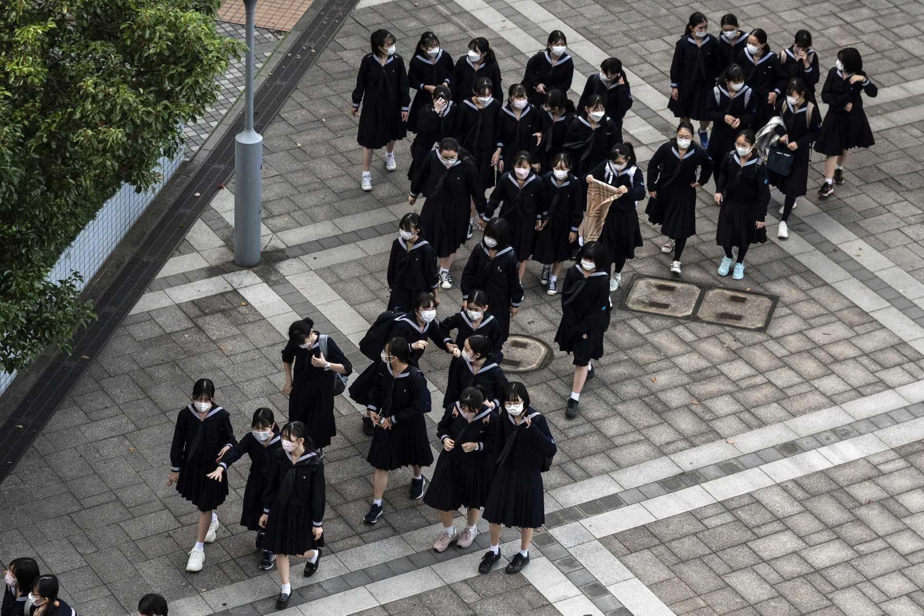Schoolgirls are pictured after school in Tokyo on Nov 4, 2021. Photo: AFP