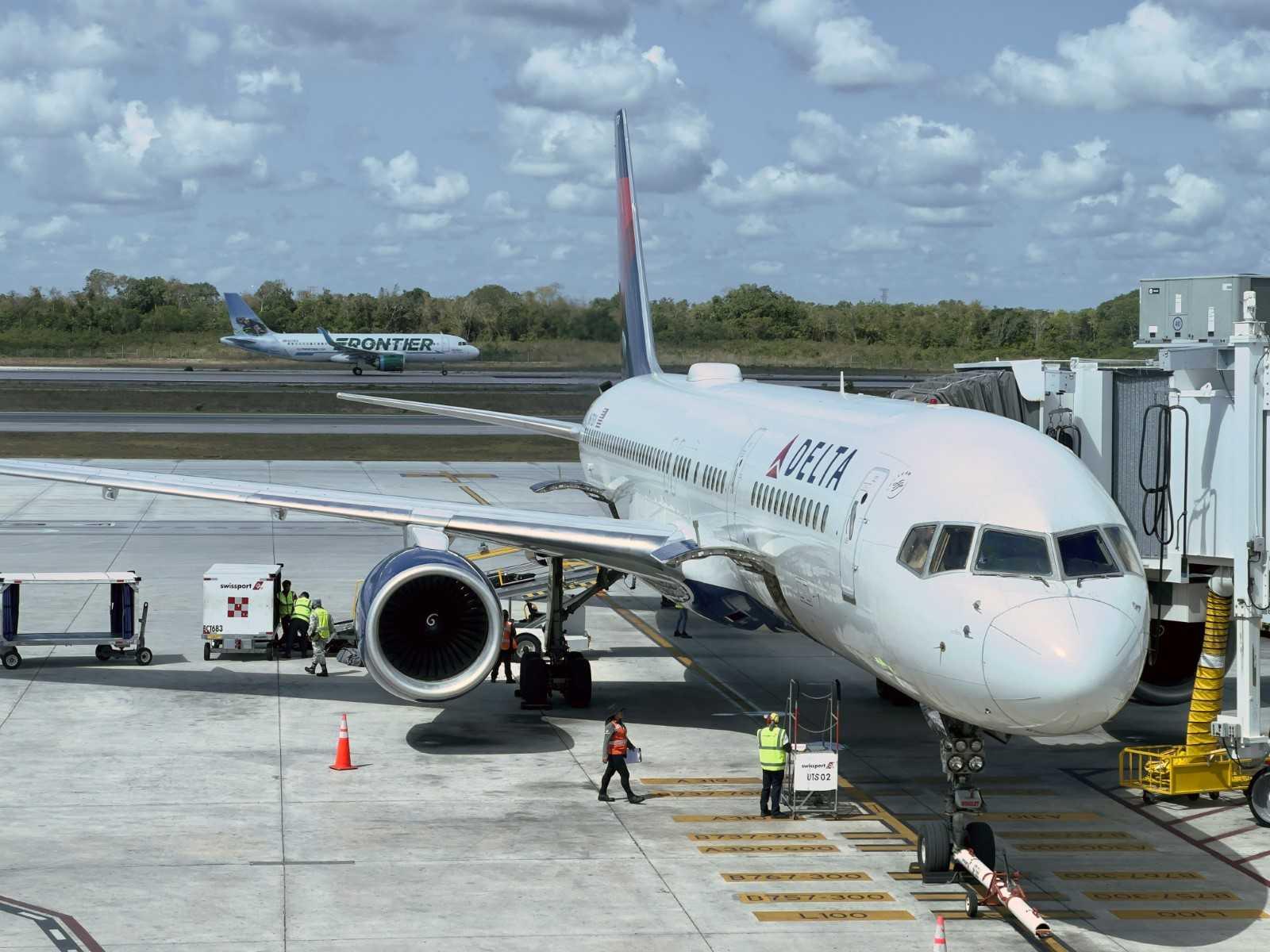 A Delta Airlines plane sits at the gate at Cancun International Airport (CUN) on May 26. Photo: AFP