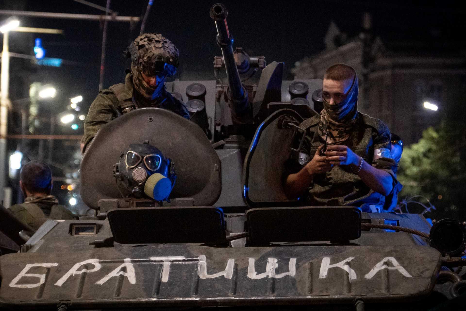 Members of Wagner group looks from a military vehicle with the sign read as 'Brother' in Rostov-on-Don late on June 24. Photo: AFP