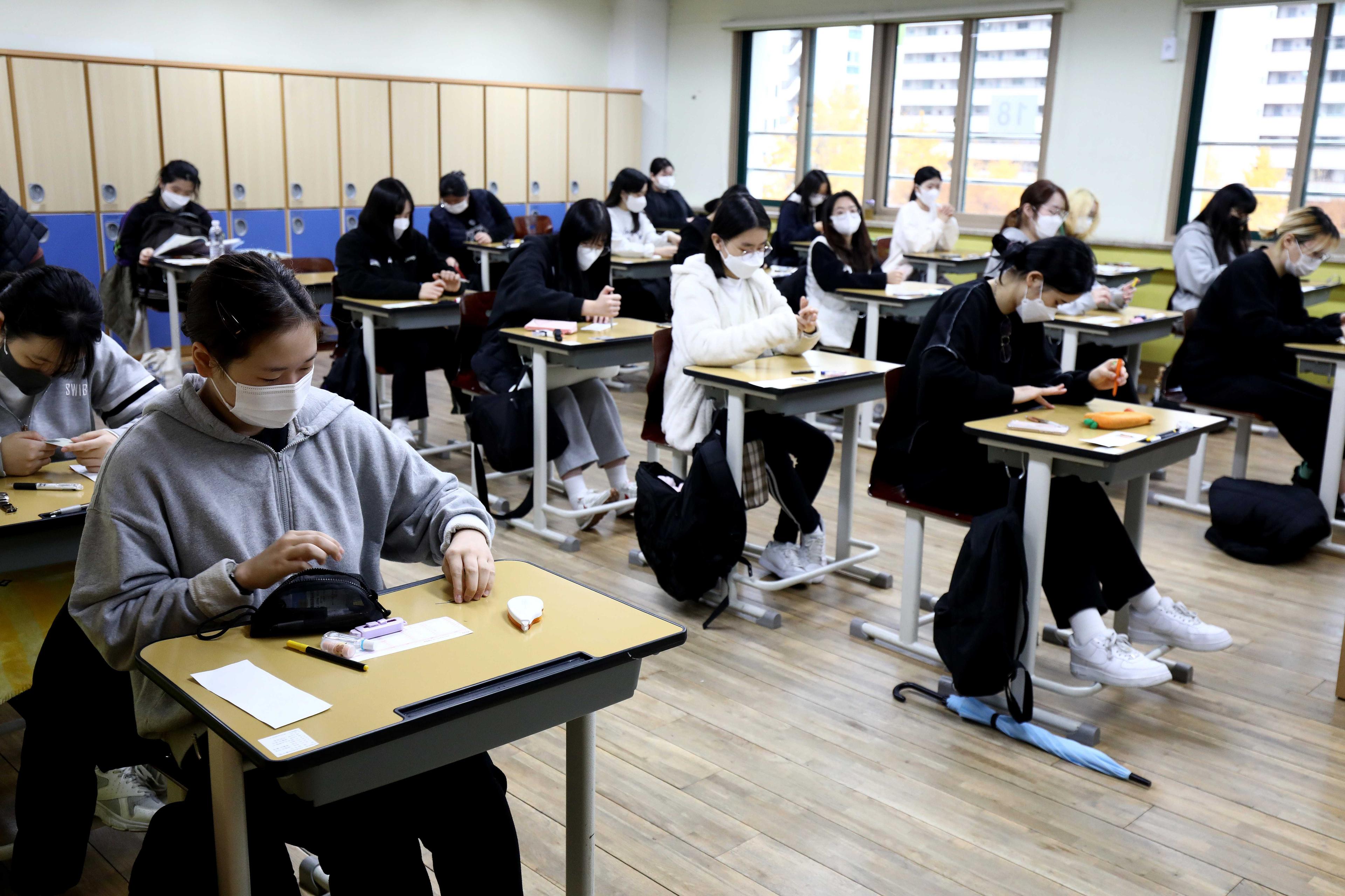 Students sit for the annual college entrance exams at a school in Seoul on Nov 18, 2021. Photo: AFP