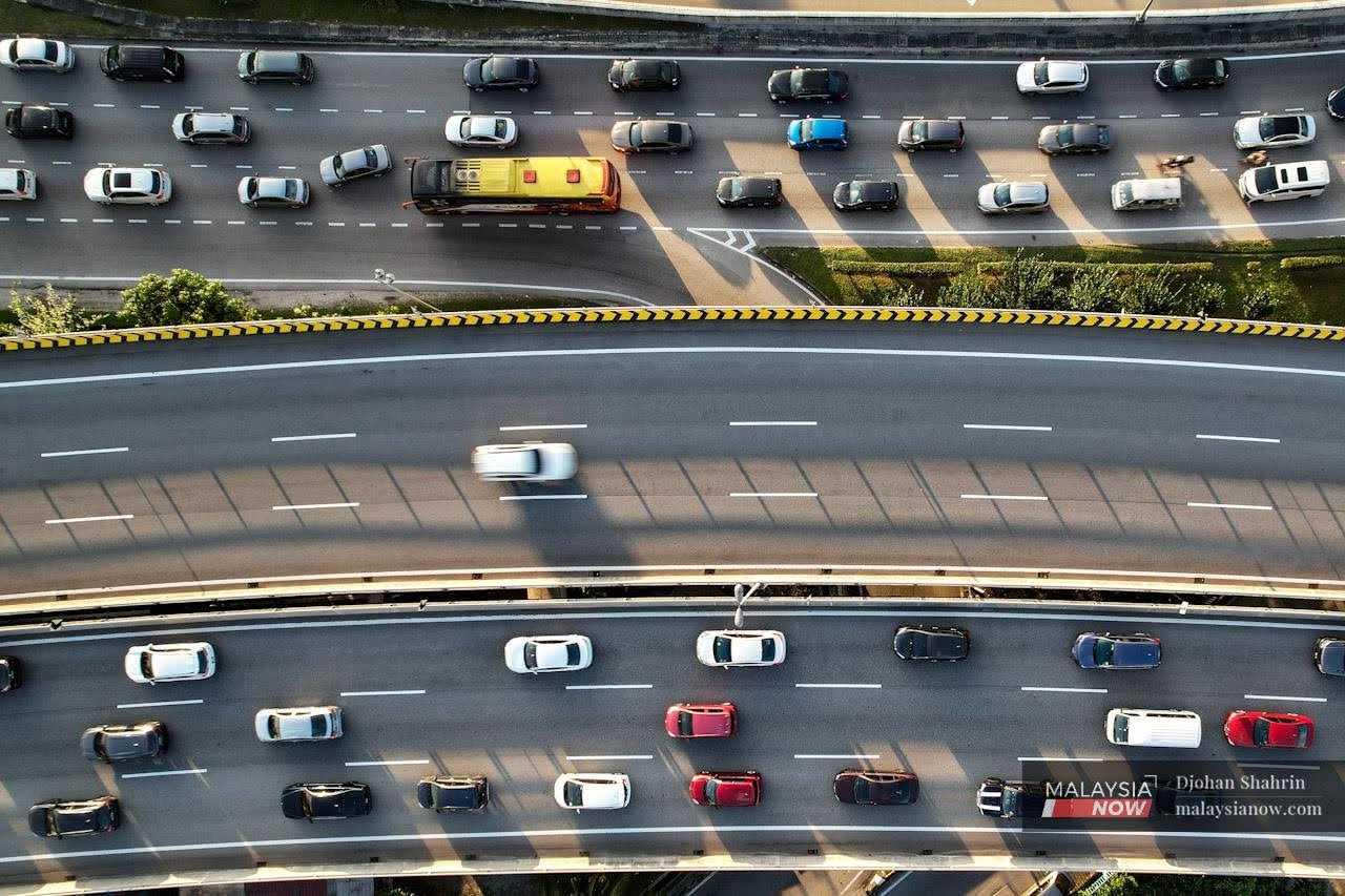 Traffic moves along a highway in the Klang Valley in this file picture.