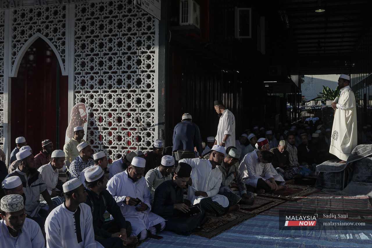 Rohingya Muslims begin the Aidiladha celebration by attending a mass prayer at a mosque near Selayang in Kuala Lumpur. 