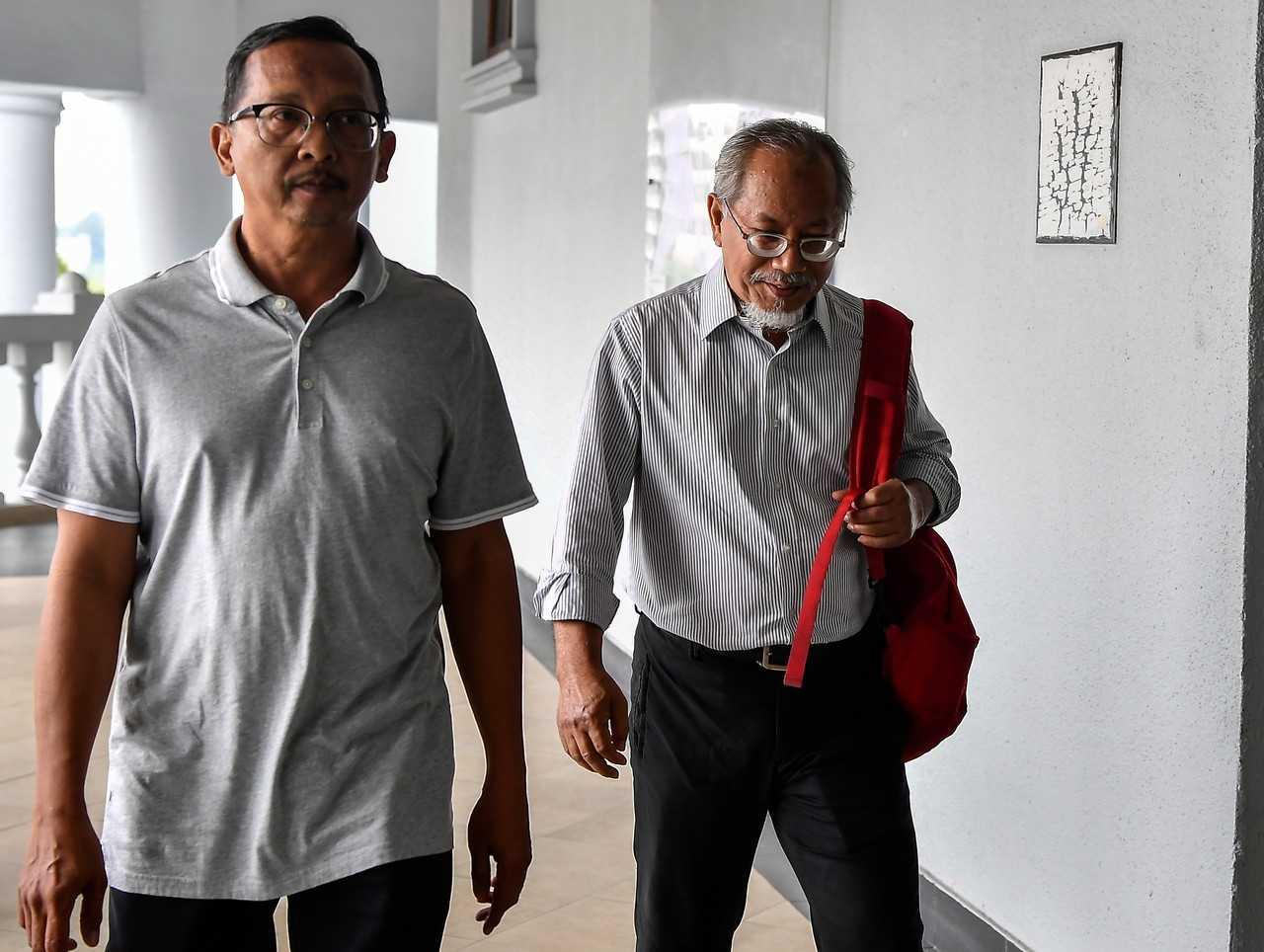 Former youth and sports ministry finance division secretary Otman Arshad (right) was found guilty by the Sessions Court today on 32 counts of abuse of power an32 charges of abuse of power and submitting false claims as well as 64 charges of money laundering. Photo: Bernama