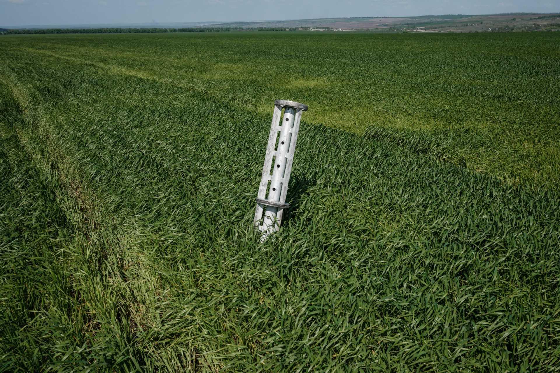 This photograph taken on May 10, 2022, shows the internal components of a cluster munition remains in a grass field near Lysychansk, eastern Ukraine, amid the Russian invasion of Ukraine. Photo: AFP