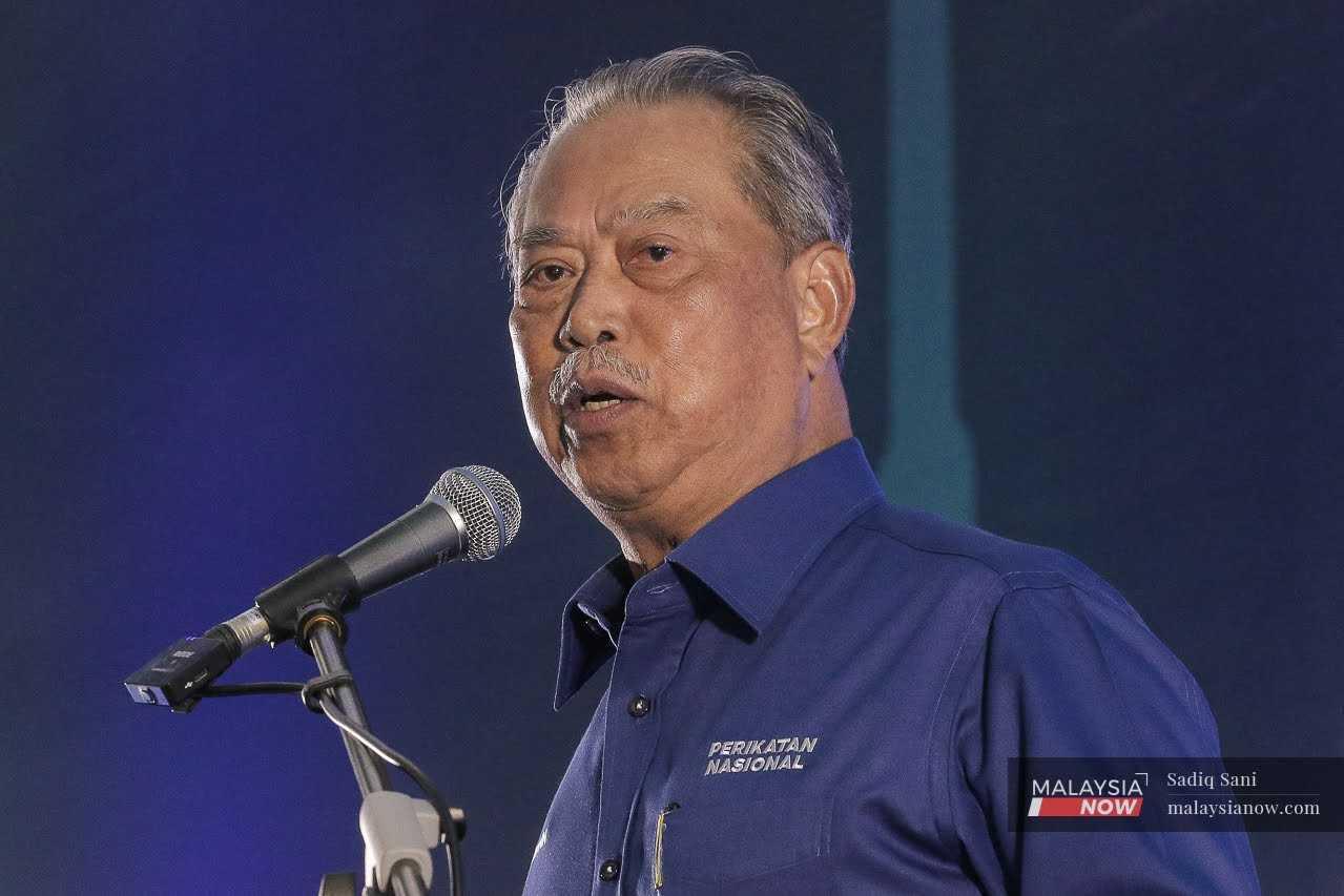 Pengerusi Perikatan Nasional Muhyiddin Yassin ketika berucap di Konvensyen Pilihan Raya PN Selangor di IDCC, Shah Alam, 24 Jun.