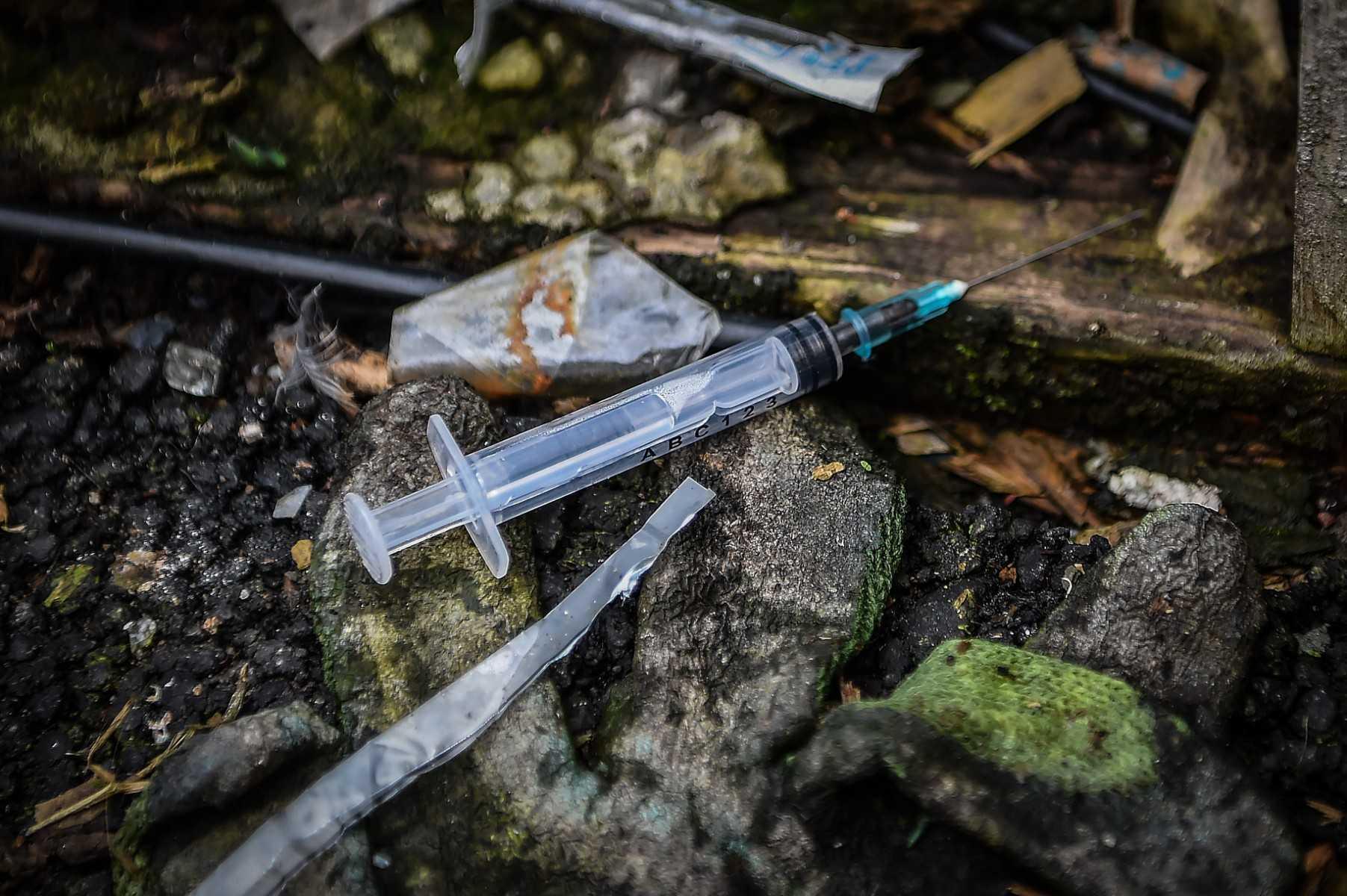 A picture shows discarded drug paraphenallia in a small wooded area used by addicts to take drugs near Glasgow city centre, Scotland, on Aug 15, 2019. Photo: AFP