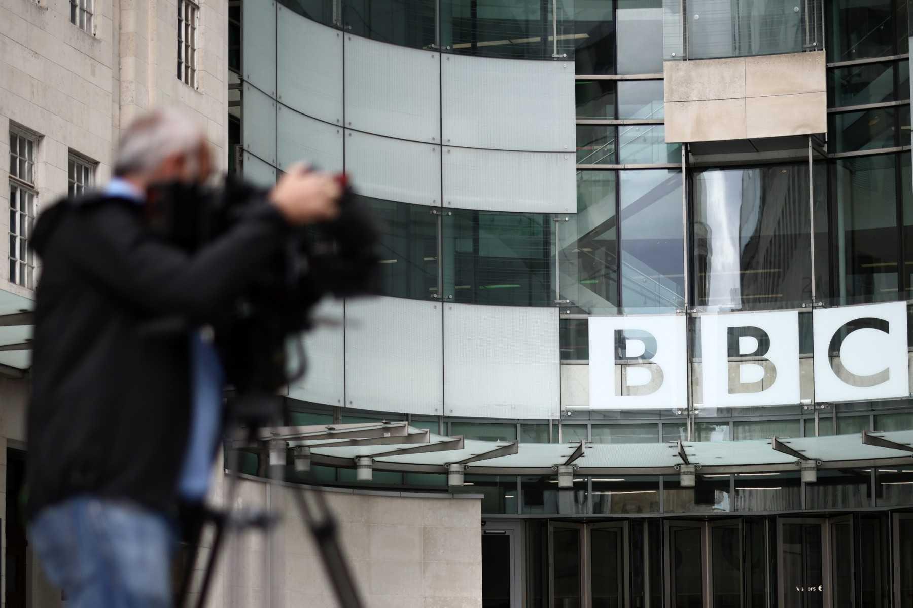 A member of the media works outside BBC Broadcasting House in central London on July 9. Photo: AFP