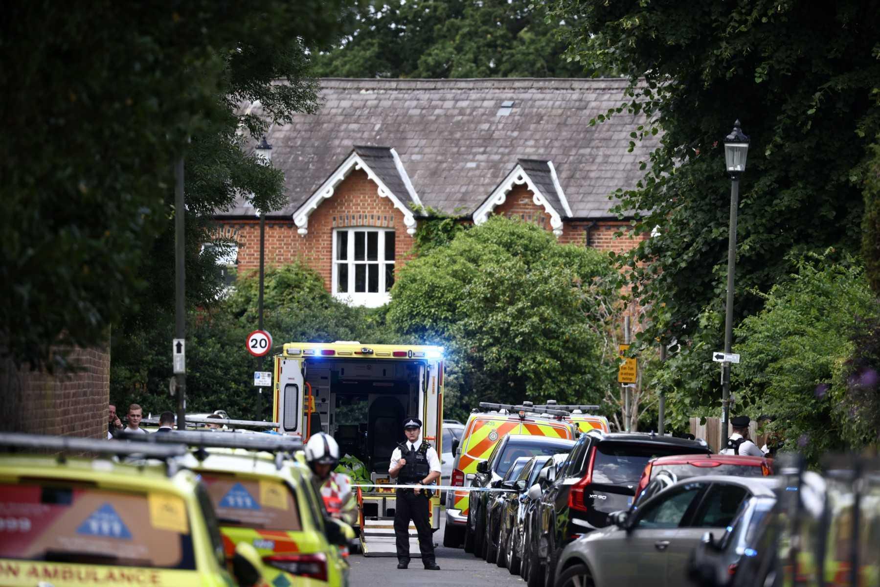 A police officer stands guard next to an ambulance behind a cordon following a car collision at the private Study Prep girls' school in Wimbledon, southwest London, on July 6. Photo: AFP