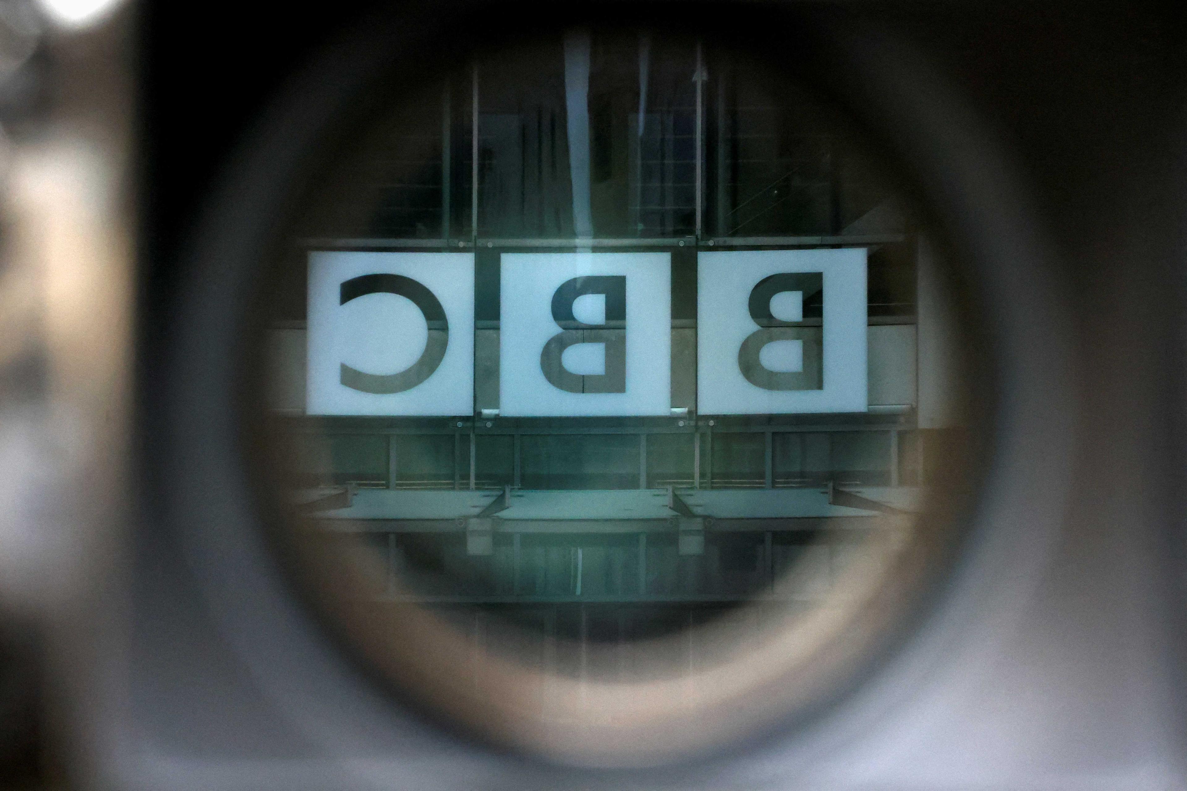 A BBC logo is reflected in the viewfinder of a television camera outside the British Broadcasting Corporation headquarters in London, Britain, March 13. Photo: Reuters