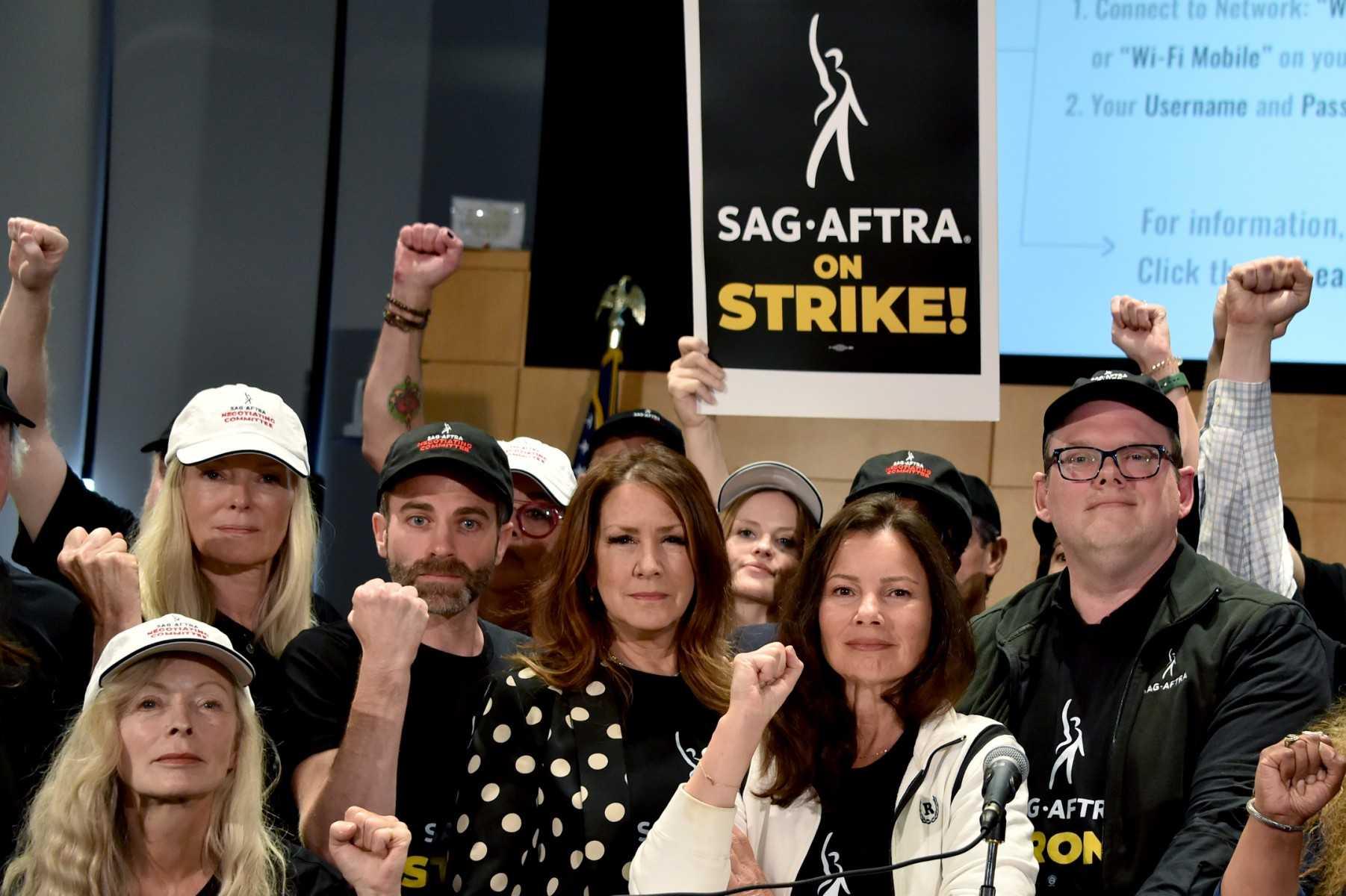 US actress Frances Fisher, SAG-Aftra secretary-treasurer US actress Joely Fisher, SAG-president US actress Fran Drescher, and national executive director and chief negotiator Duncan Crabtree-Ireland, joined by members, pose for a photo during a press conference at the labour union's headquarters in Los Angeles, California, July 13. Photo: AFP