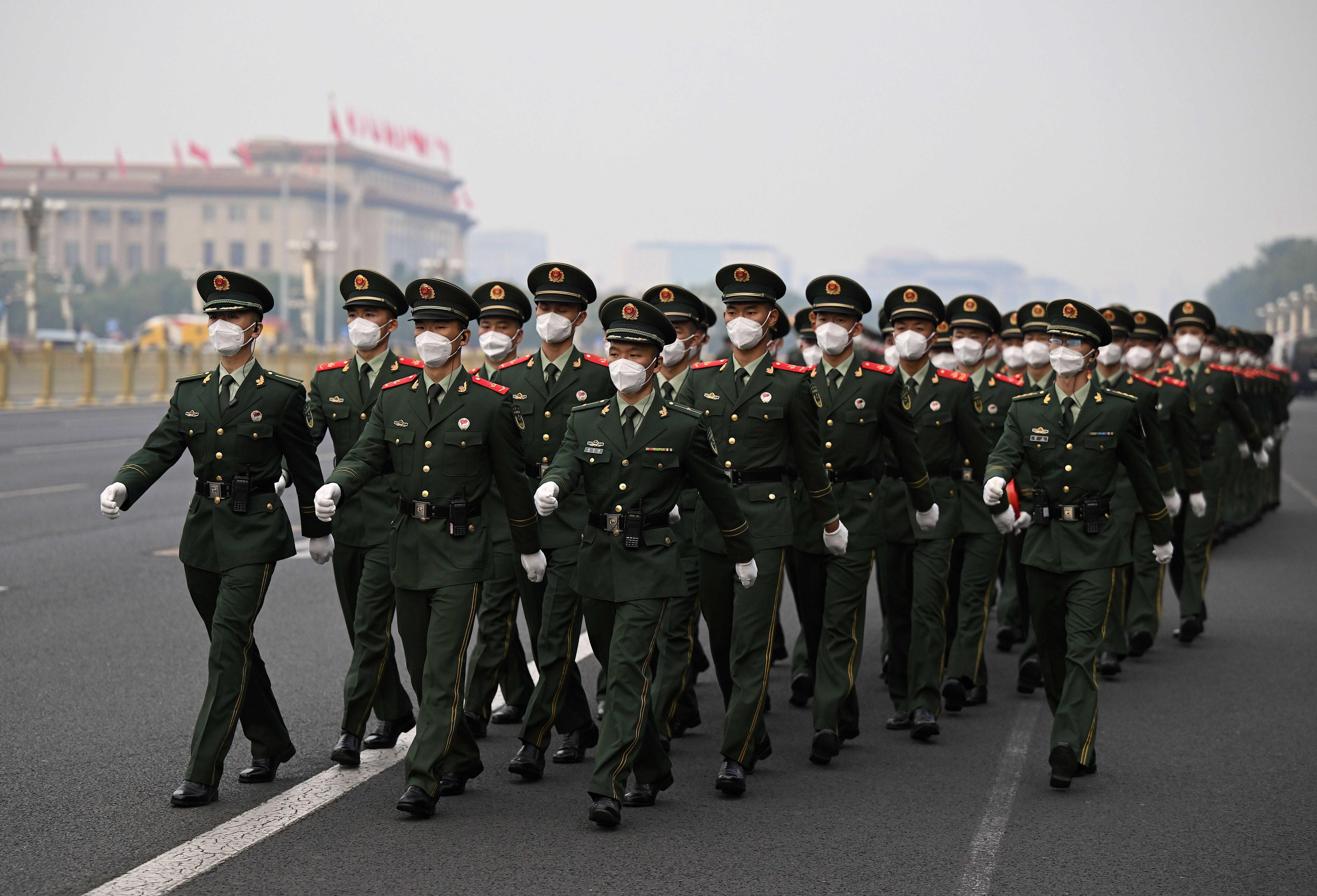 Soldiers march on Tiananmen Square after the flag-raising ceremony on China's National Day in Beijing on Oct 1, 2022. Photo: AFP