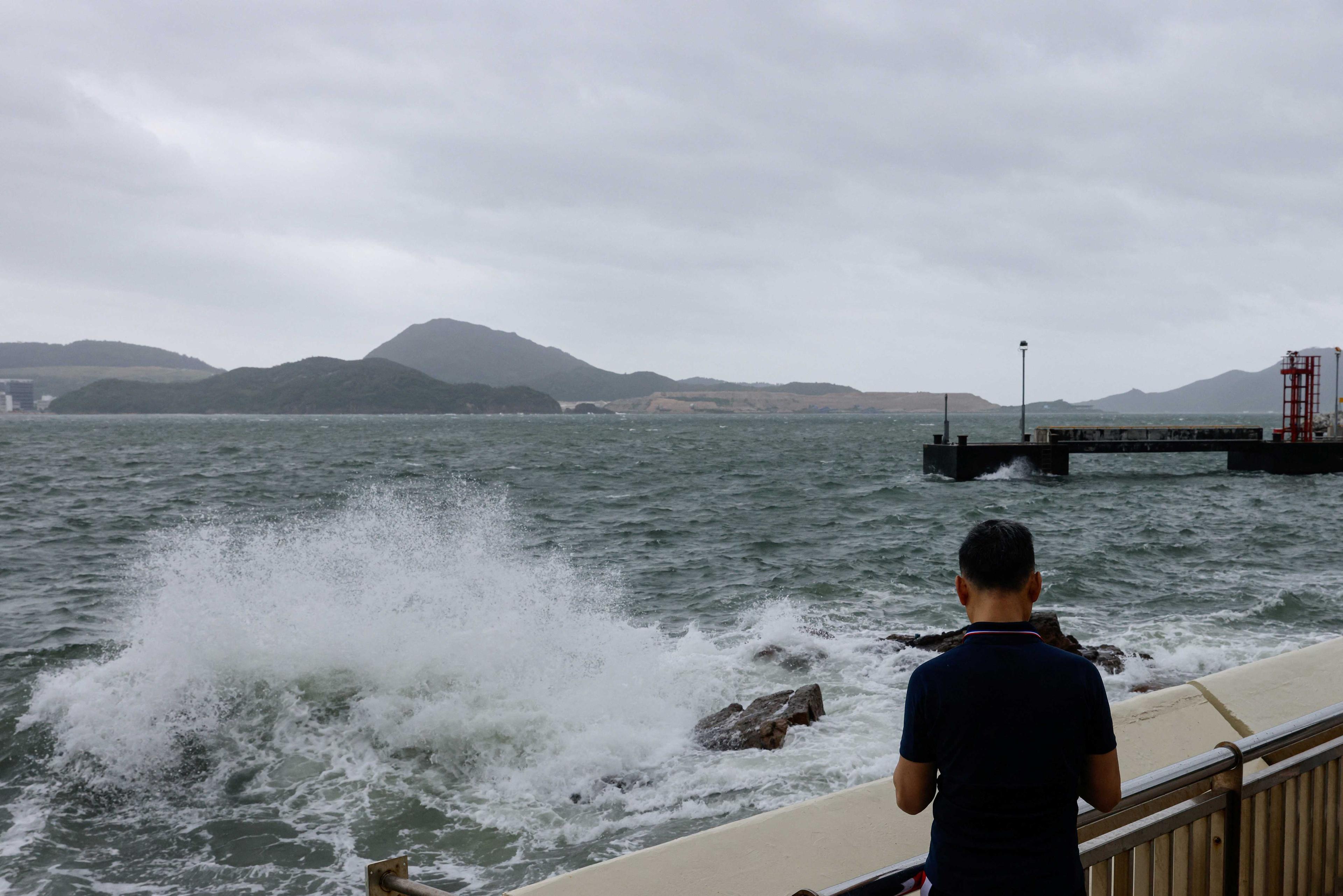 A man watches the waves at the seaside as Typhoon Talim approaches, in Hong Kong, China, July 17. Photo: Reuters