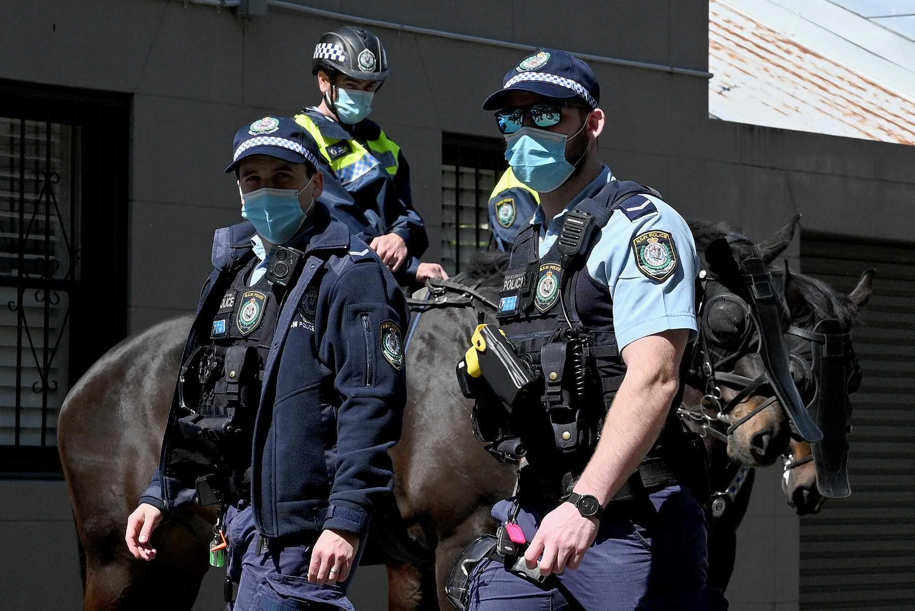 Police officers stand guard in Sydney on Sept 21, 2021. Photo: AFP 