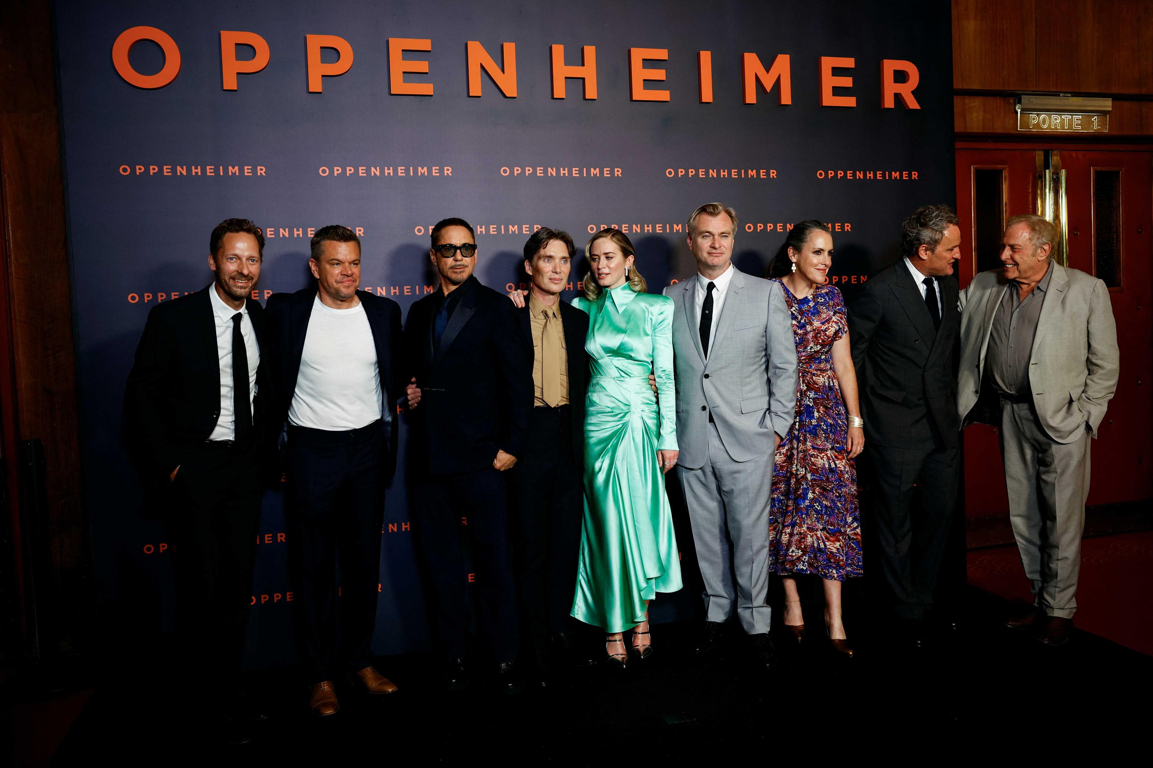 Cast members, Director Christopher Nolan and his wife Emma Thomas, and Producer Charles Roven pose during a photocall before the premiere of the film 'Oppenheimer' at the Grand Rex in Paris, France, July 11. Photo: Reuters