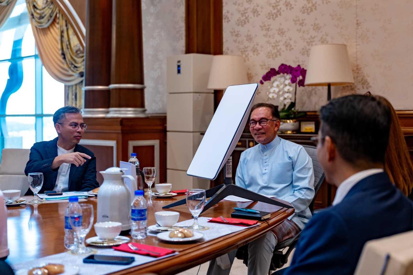 Prime Minister Anwar Ibrahim with Communications and Digital Minister Fahmi Fadzil. Photo: Facebook