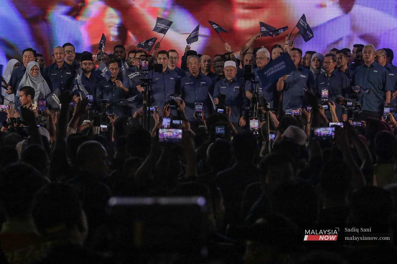 Perikatan Nasional chairman Muhyiddin Yassin with other coalition leaders and the candidates for the Selangor election in Taman Medan, July 26.