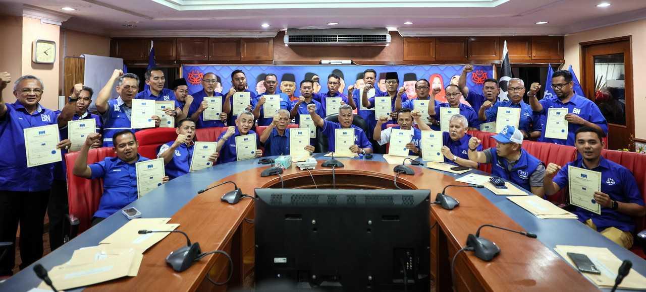 Terengganu Barisan Nasional chairman Ahmad Said (seated, centre) with the candidates for the state election in Kuala Terengganu, July 27. Photo: Bernama