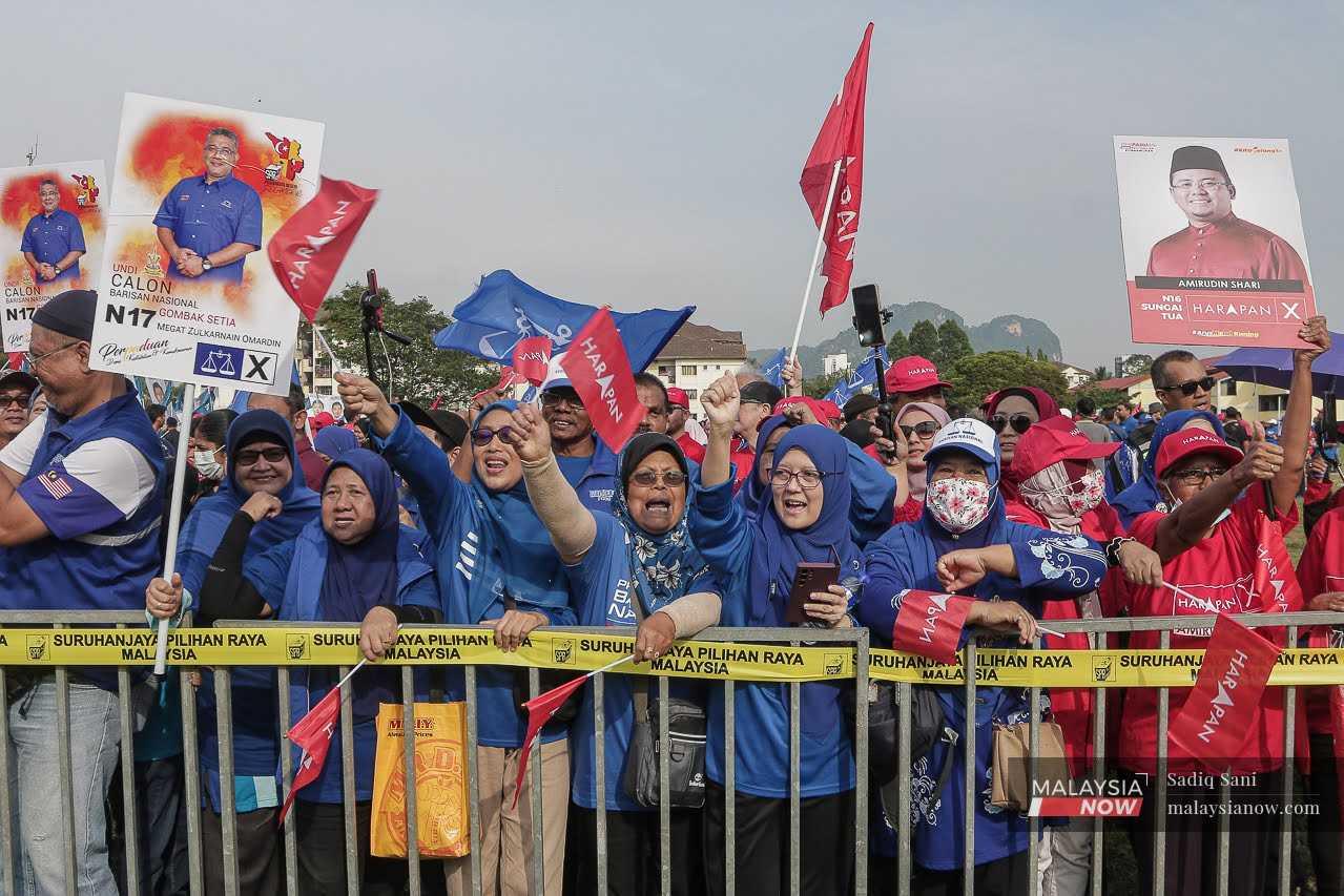 Supporters of Pakatan Harapan-Barisan Nasional at the nomination centre in Gombak, July 29.