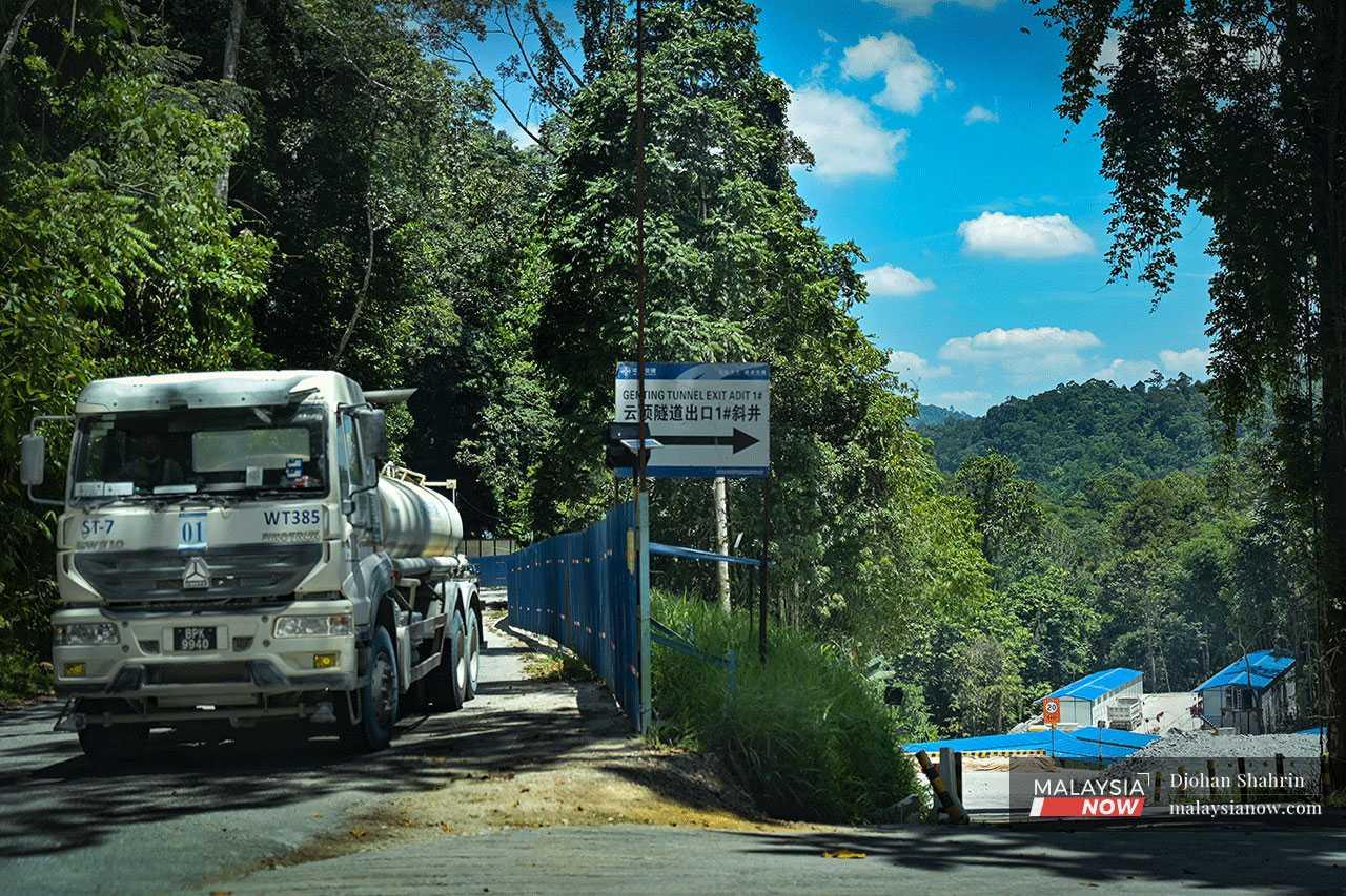 A China Communications Construction Company or CCCC lorry passes through the Gombak-Karak highway for construction work at the Genting Tunnel near the workers' dorm in Batu 16, Gombak.