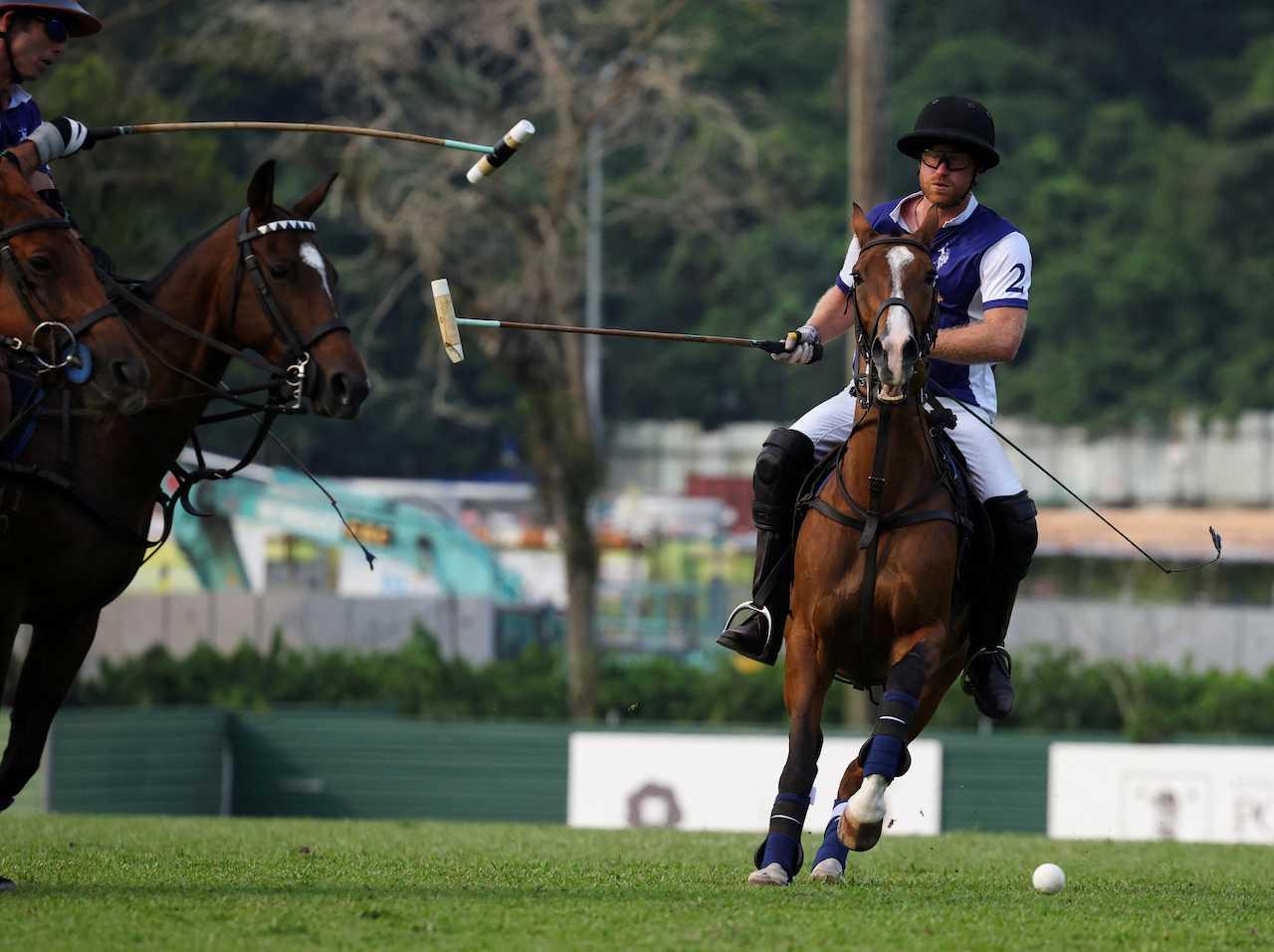 Britain’s Prince Harry, the Duke of Sussex, plays in the Sentebale ISPS Handa Polo Cup at the Singapore Polo Club in Singapore, Aug 12. Photo: Reuters
