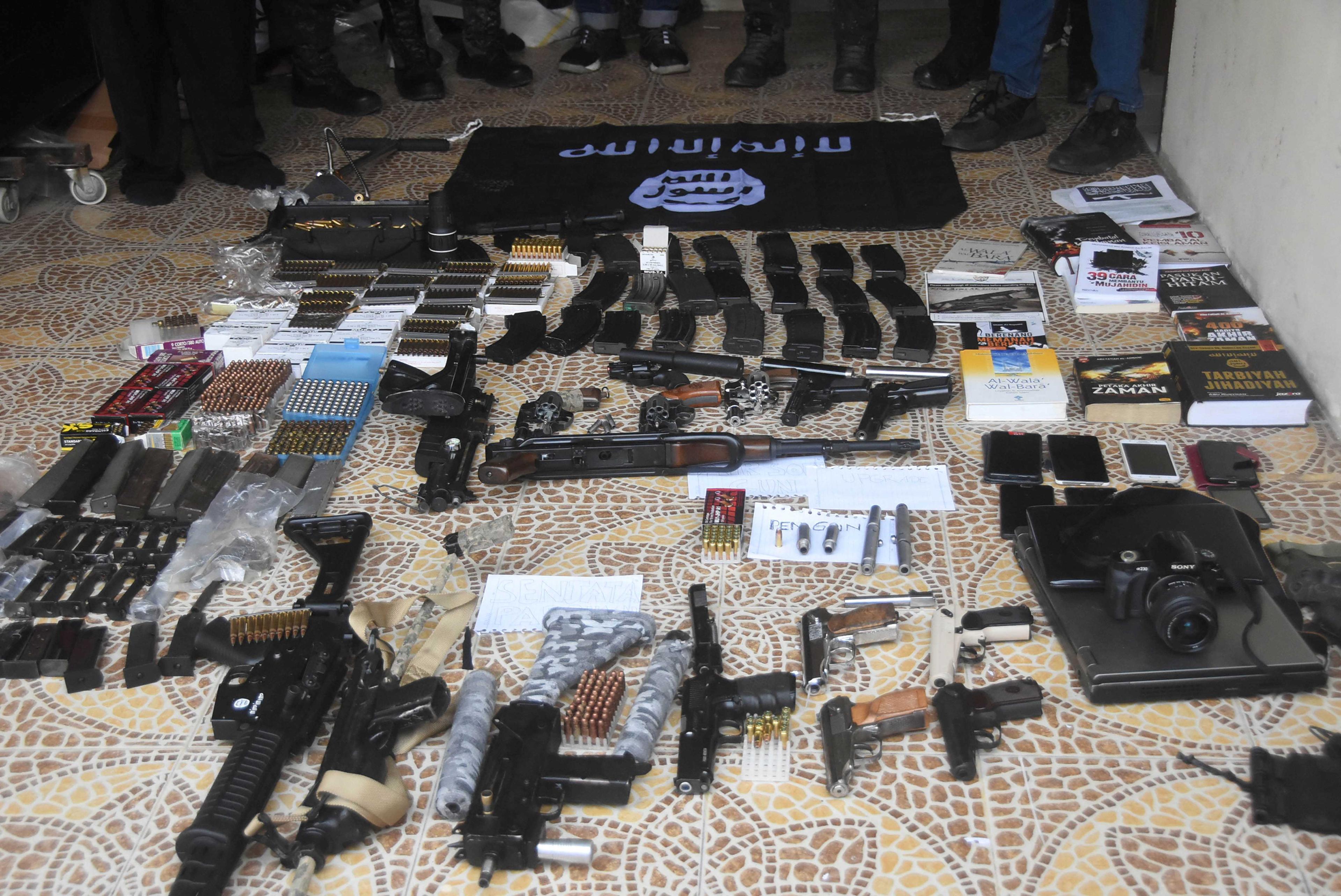 Firearms and items seized by Indonesian anti-terror squad (Densus 88), are shown after a man was arrested, allegedly as an Islamic State of Iraq and Syria (Isis) sympathiser, in Bekasi, West Java province, Indonesia Aug 14. Photo: Reuters