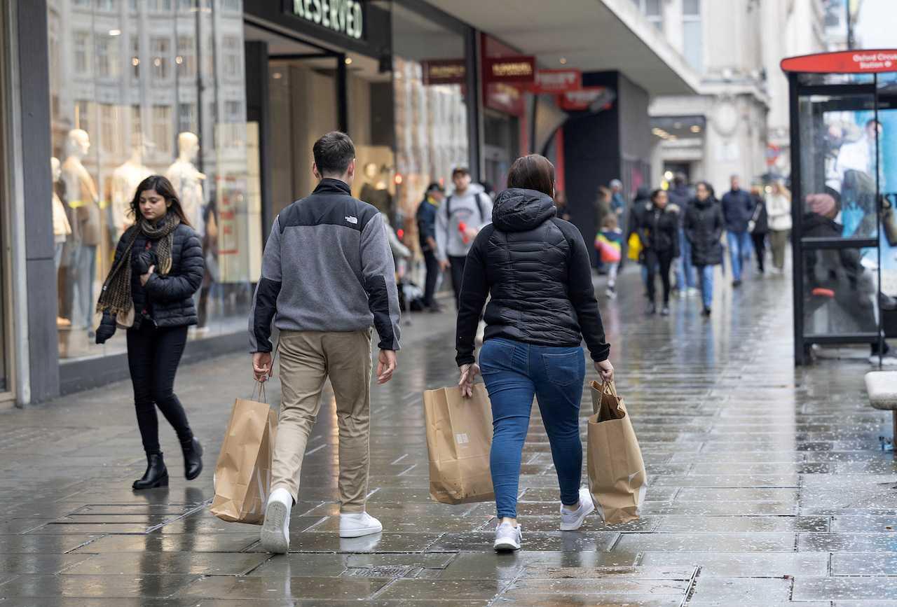 People shop on Oxford Street in London, Britain, April 10. Photo: Reuters