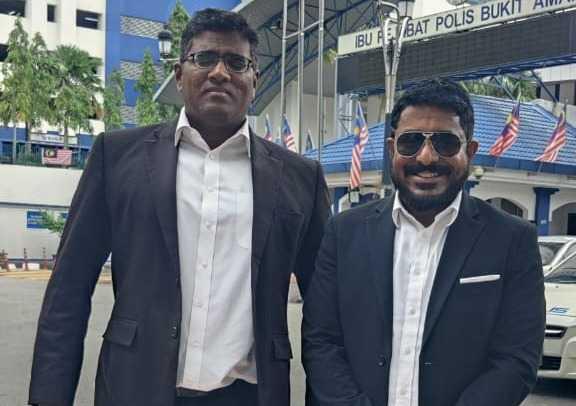 Arun Dorasamy (right) with his lawyer Rajesh Nagarajan outside the Bukit Aman police headquarters in Kuala Lumpur yesterday.