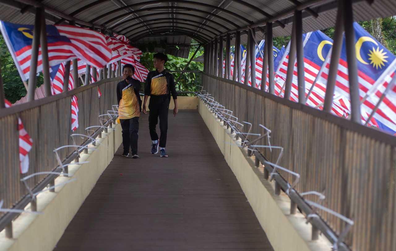 Malaysian flags flutter at an overpass in the Labuan city centre ahead of Merdeka Day on Aug 15. Photo: Bernama