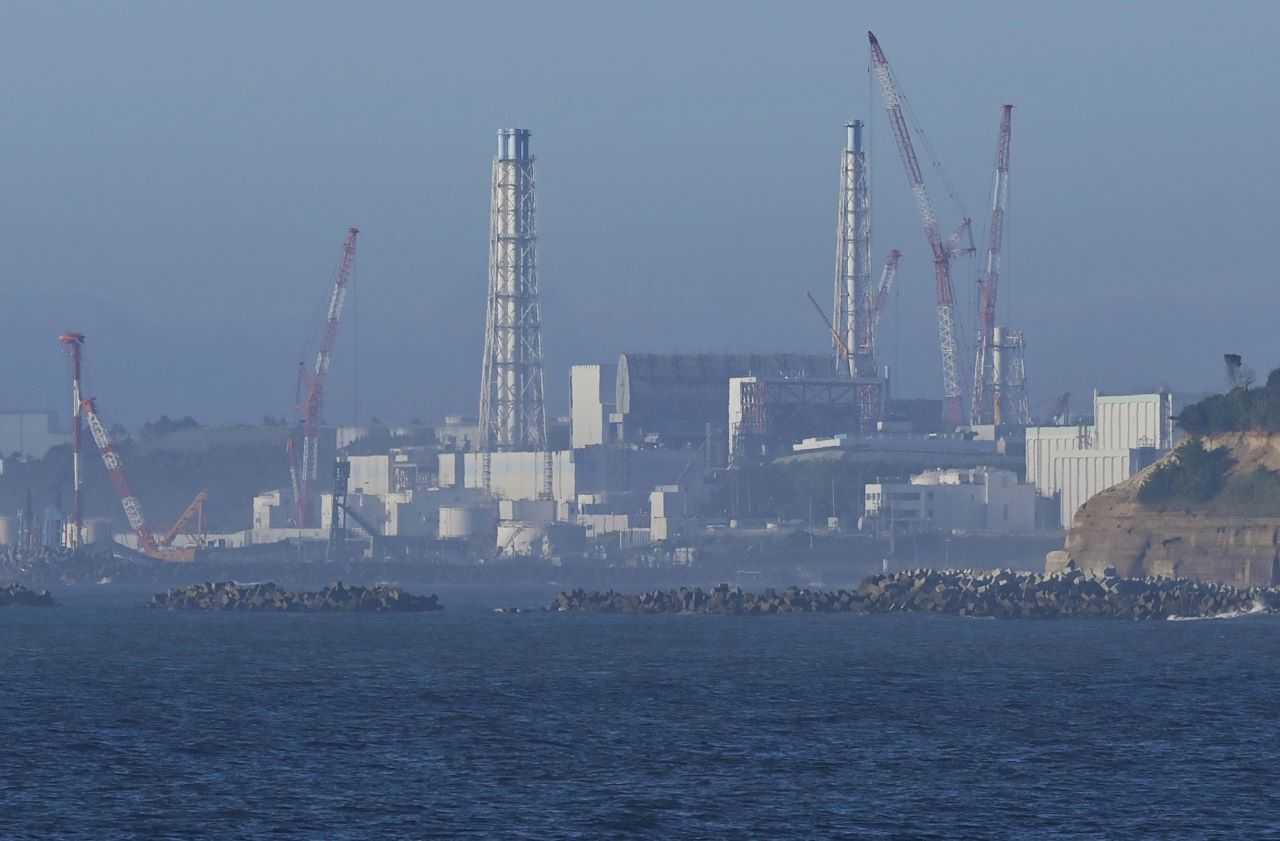 The tsunami-crippled Fukushima Daiichi nuclear power plant is seen from Namie Town, Fukushima prefecture, Japan Aug 24, in this photo taken by Kyodo. Photo: Reuters