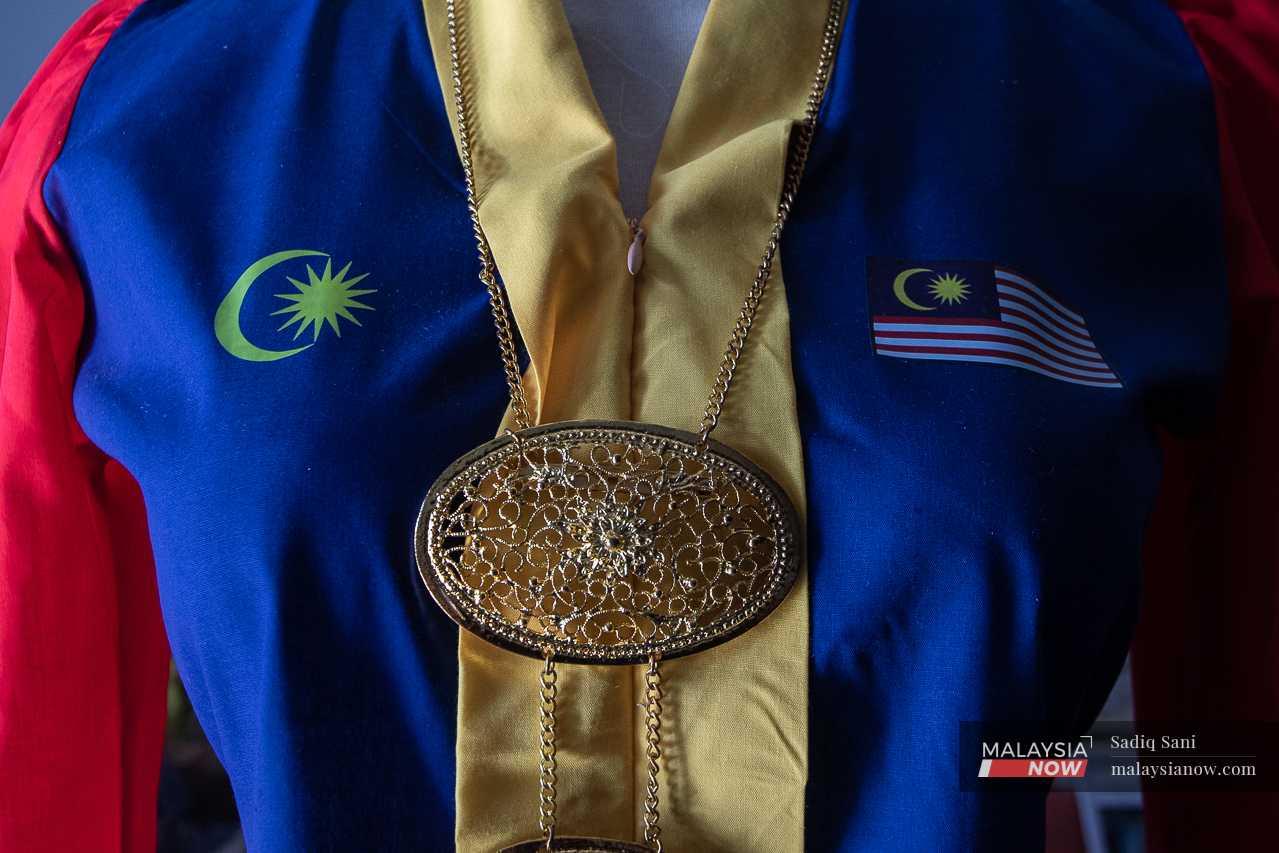 The exquisite Jalur Gemilang kebaya takes its place at the front of Helmaliza's shop.