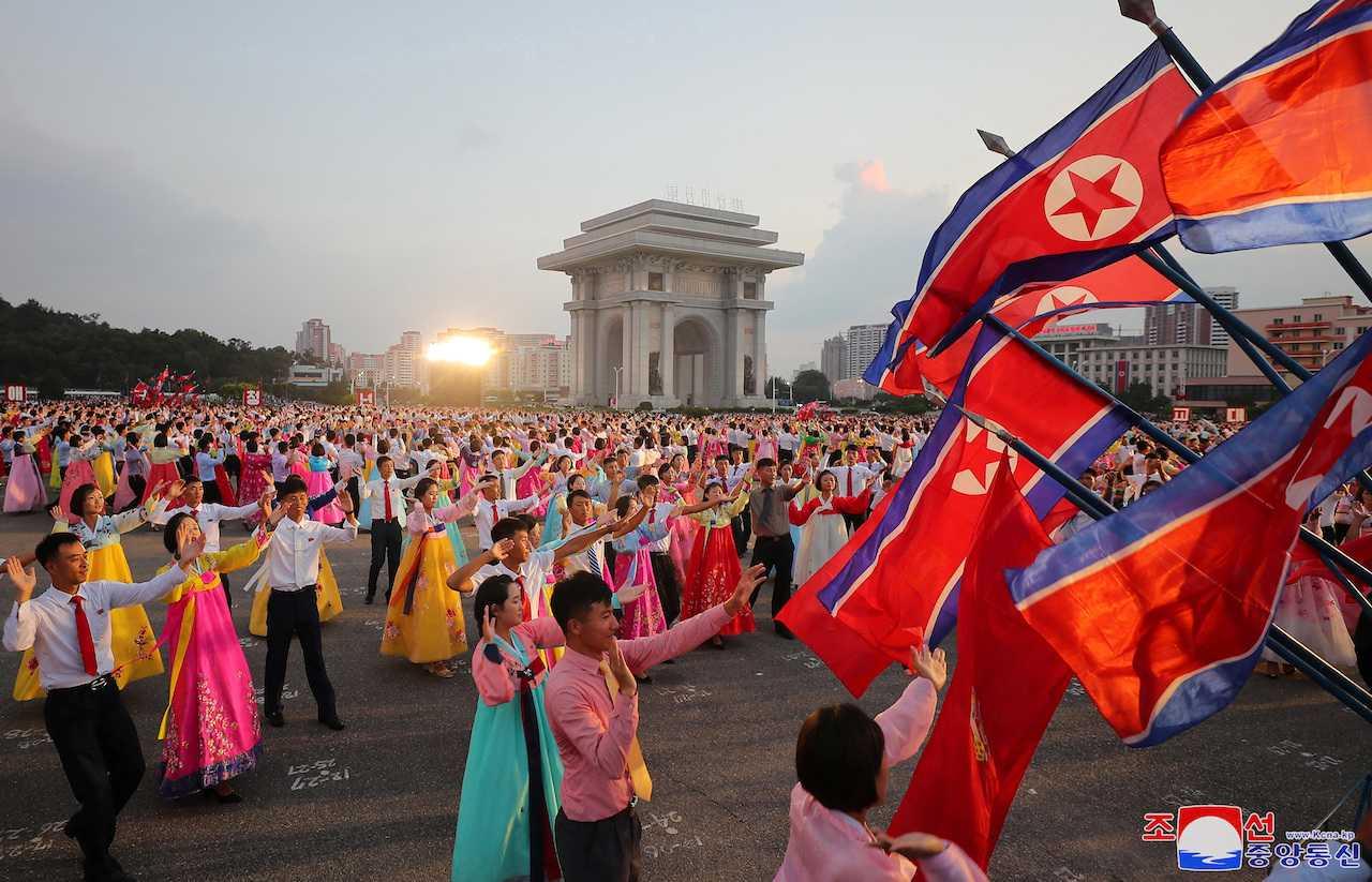 People take part in an evening party on the occasion of the 78th anniversary of Korea's liberation from Japan's 1910-45 colonial rule at the Arch of Triumph, in Pyongyang, North Korea, Aug 15, in this photo released by the Korean Central News Agency. Photo: Reuters
