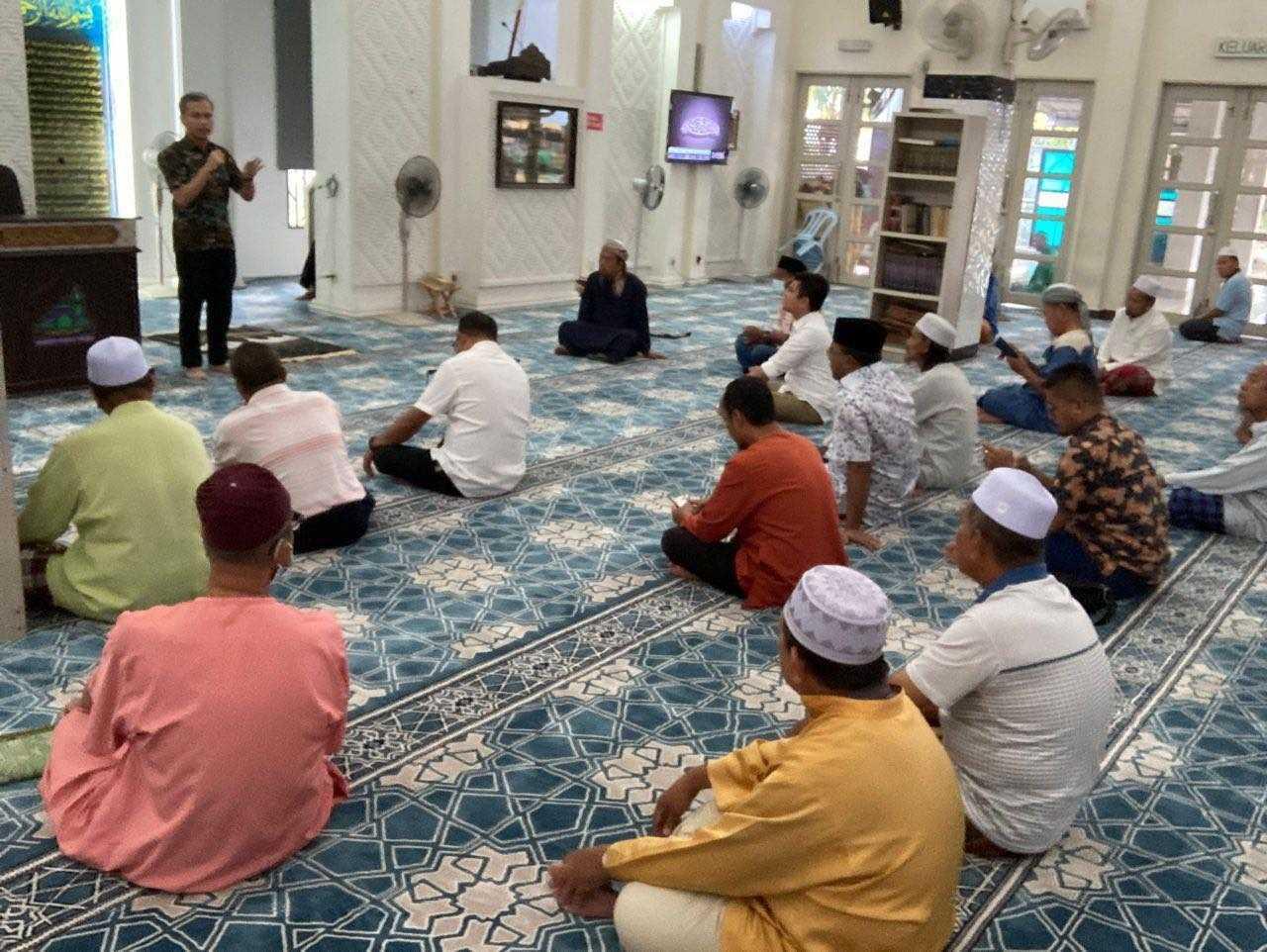 Communications and Digital Minister Fahmi Fadzil speaks inside a mosque in Selangor, July 30.